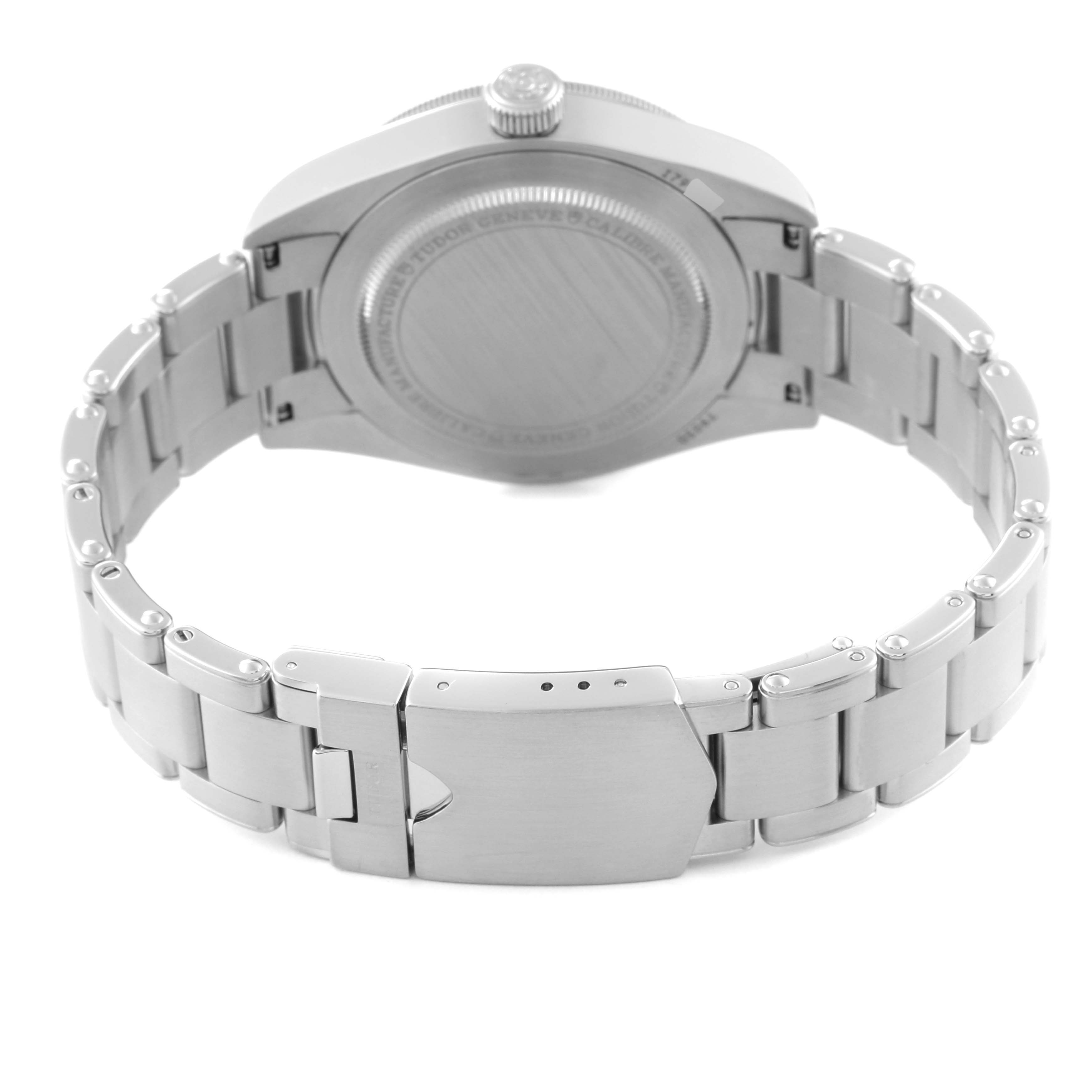 The image shows the back case and bracelet of a Heritage Black Bay model by Tudor, viewed from the rear.