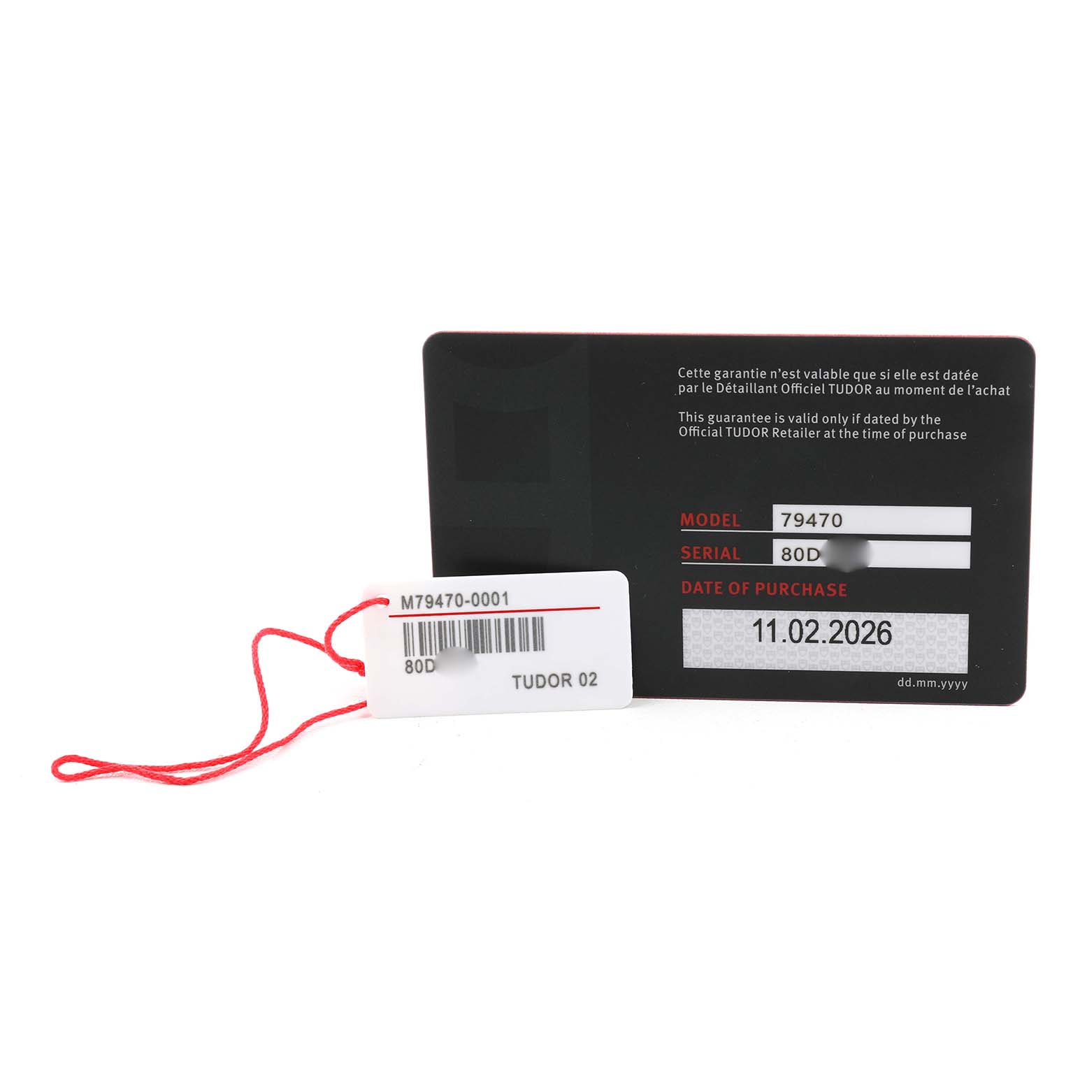 The image shows a warranty card and tag for the Tudor Heritage Black Bay M79470-0001 Men's Stainless Steel Black Dial, displaying model and serial numbers.