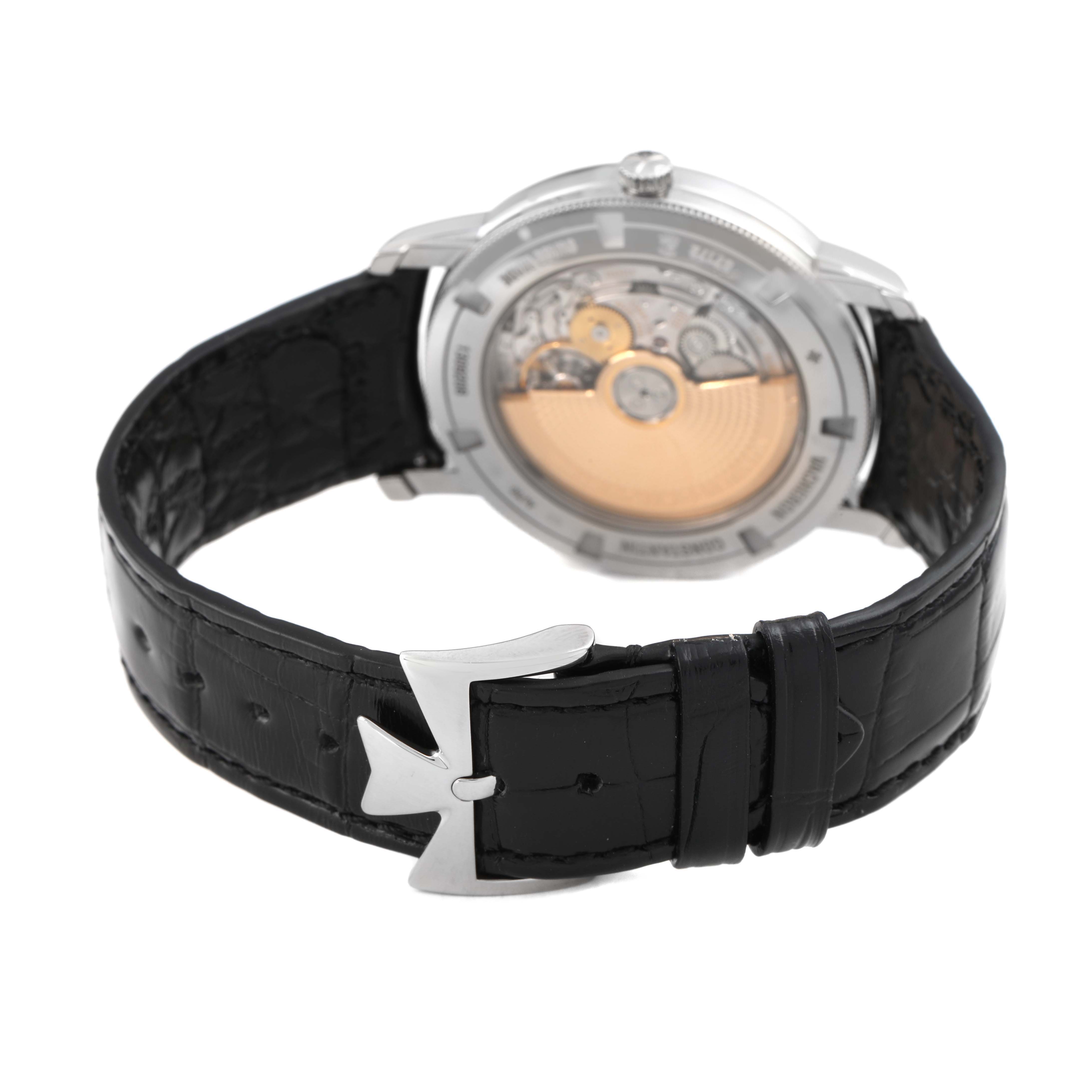 The Vacheron Constantin Traditionnelle 87172/000G-9301 Men's White Gold Silver Dial watch is shown from the back, displaying its movement and leather strap with a metal clasp.