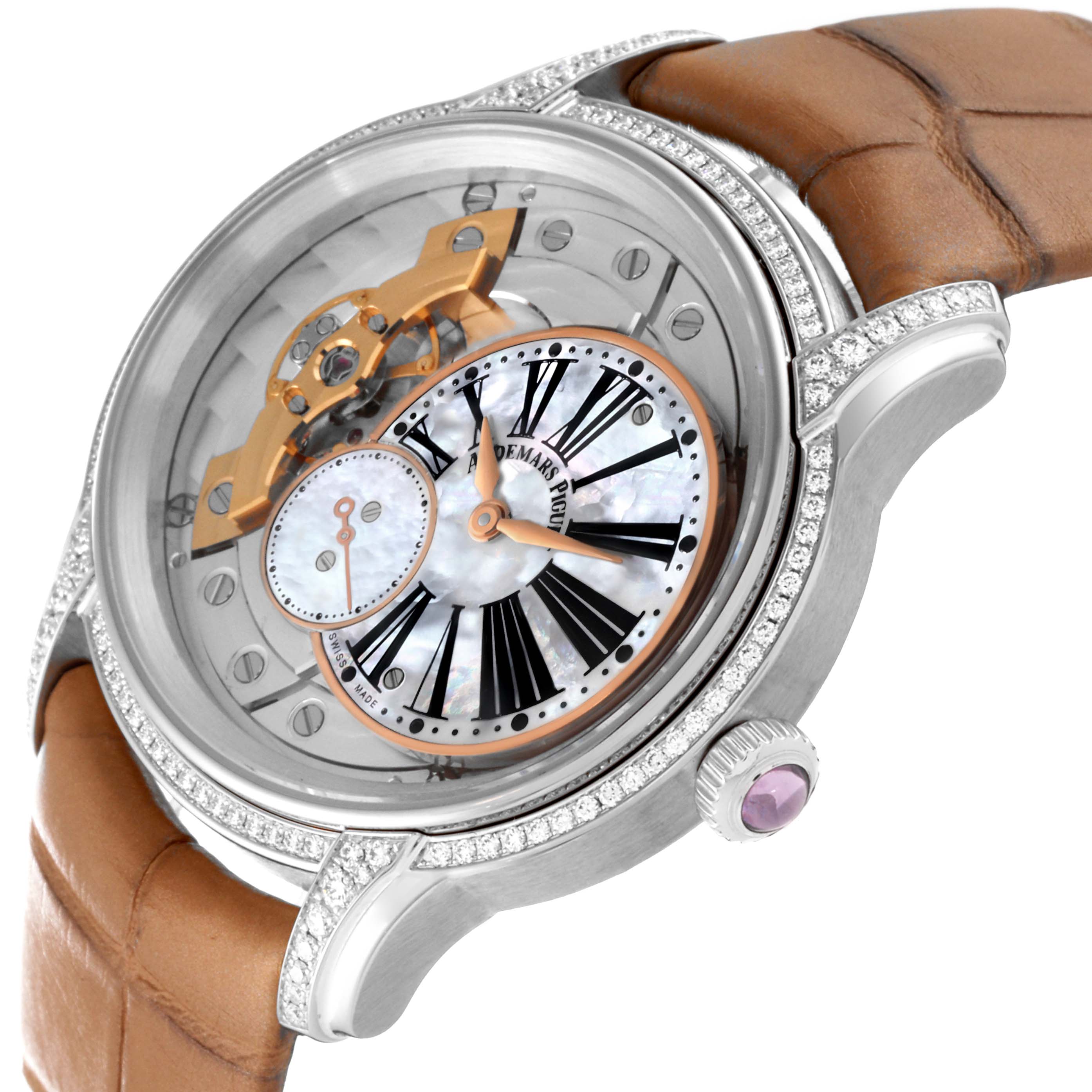 This image shows an angled close-up of the Audemars Piguet Millenary 77247BC.ZZ.A813CR.01 Women's White Gold Mother of Pearl Dial 77247BC.ZZ.A813CR.01 Women's White Gold Mother of Pearl Dial watch, featuring its dial, case, crown, and brown strap.
