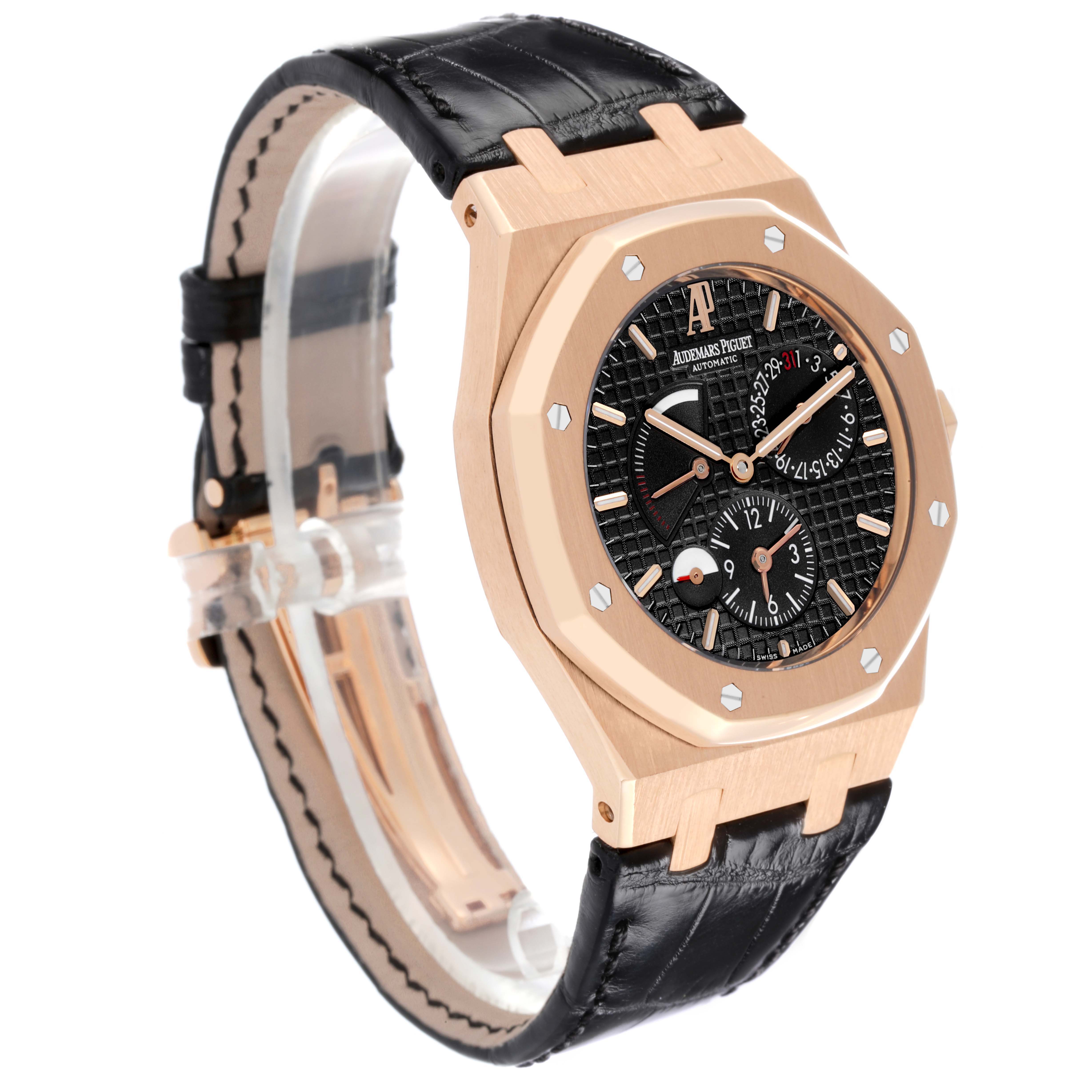 The Audemars Piguet Royal Oak 26120OR Men's Rose Gold Black Dial 26120OR Men's Rose Gold Black Dial watch is shown at a slight angle, highlighting the face, bezel, and black leather strap.