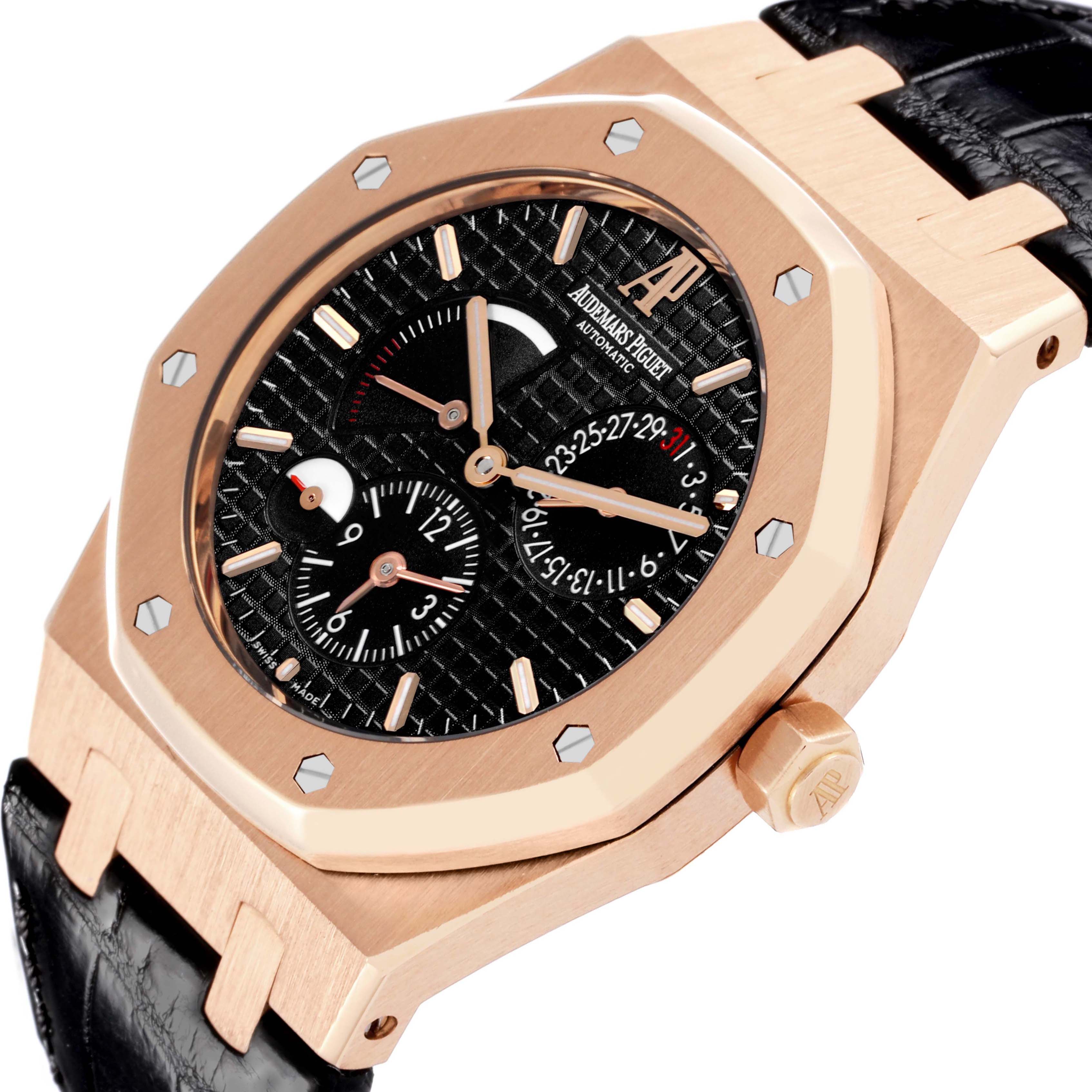 The Audemars Piguet Royal Oak 26120OR Men's Rose Gold Black Dial 26120OR Men's Rose Gold Black Dial watch is shown at a side angle highlighting the bezel, dial, subdials, and strap connection.