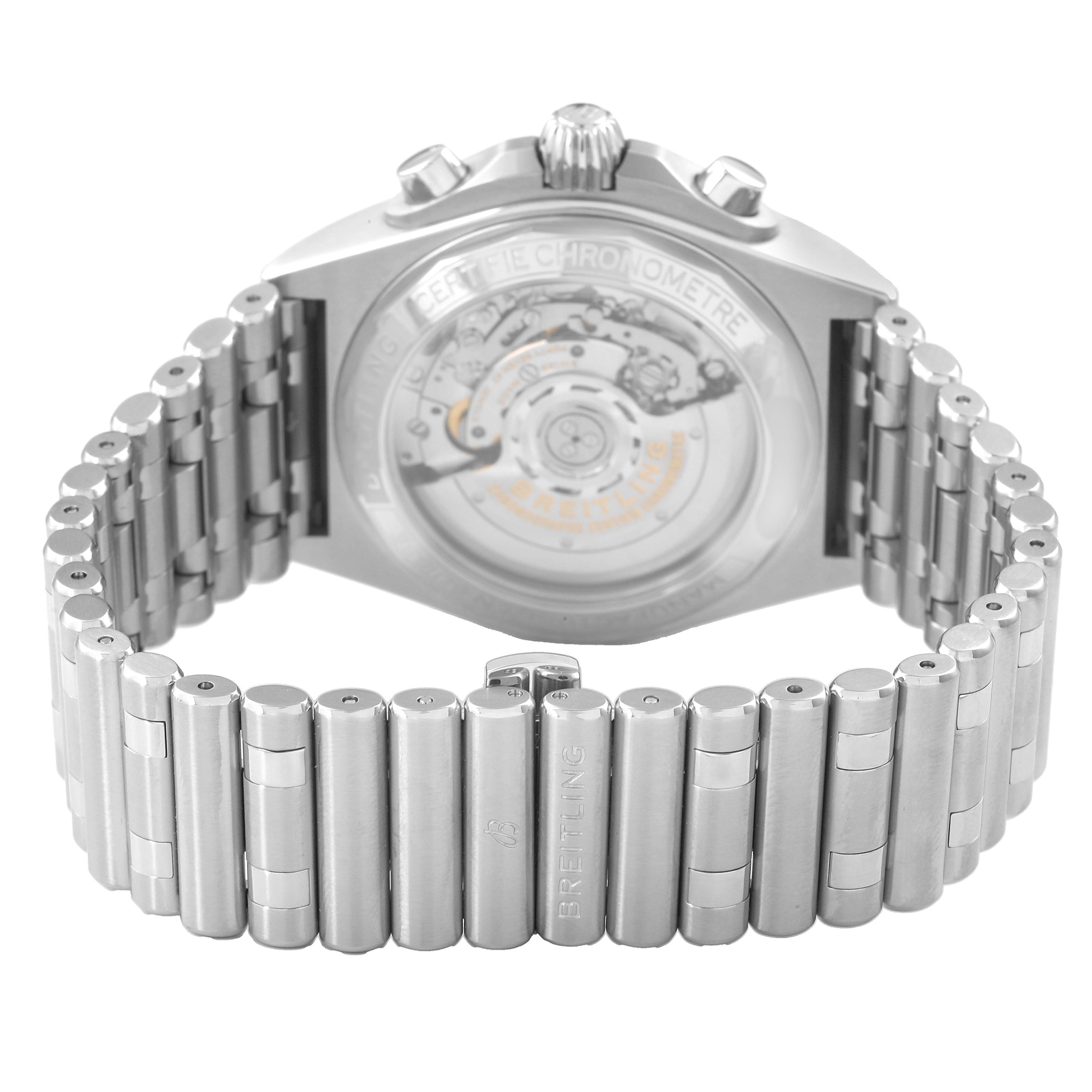 The image shows the back of a Breitling Chronomat AB0134 Men's Stainless Steel Black Dial watch, featuring an exhibition case back and stainless steel bracelet.