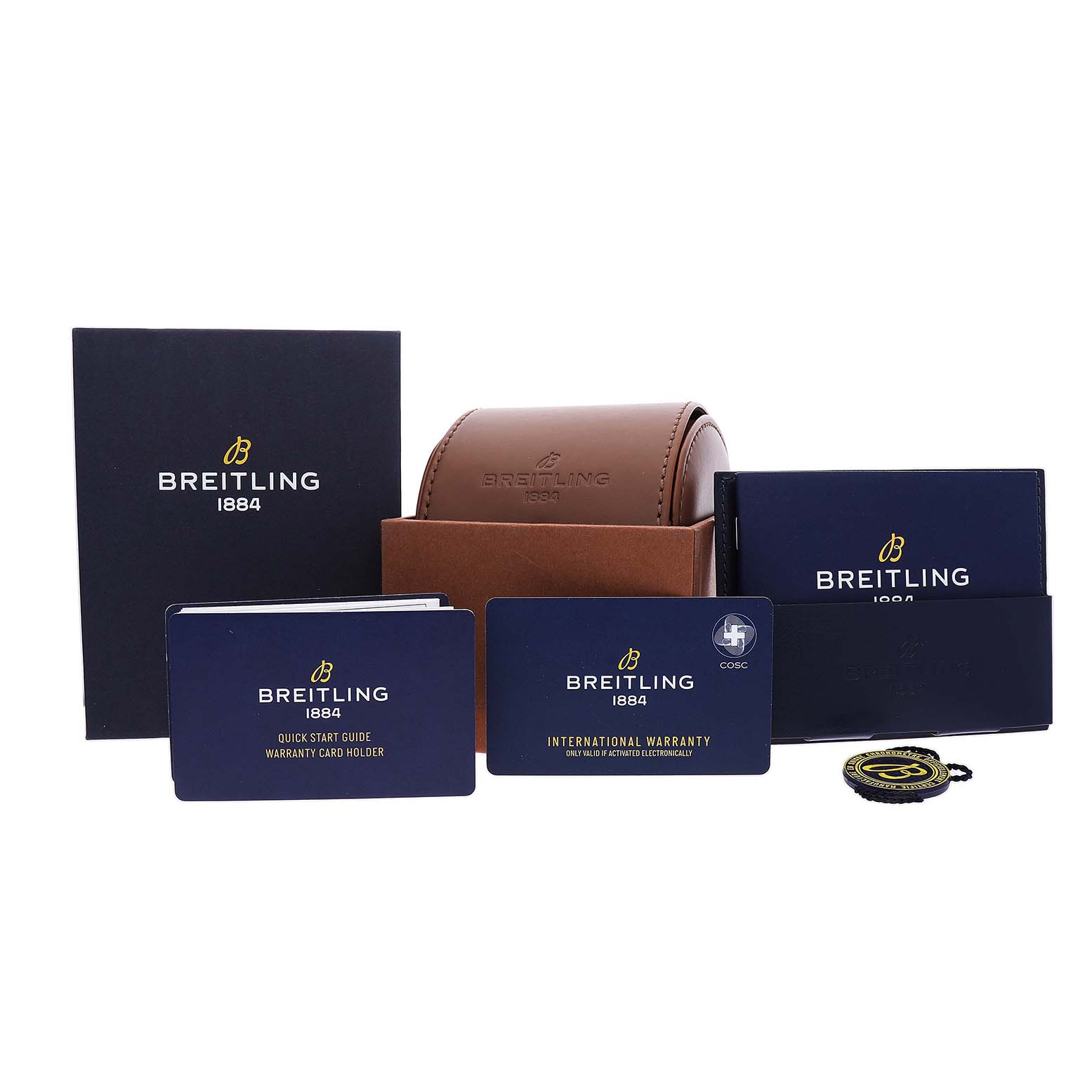 The image shows Breitling Chronomat AB0134 Men's Stainless Steel Black Dial accessories, including a brown watch case, manuals, warranty cards, and a tag.