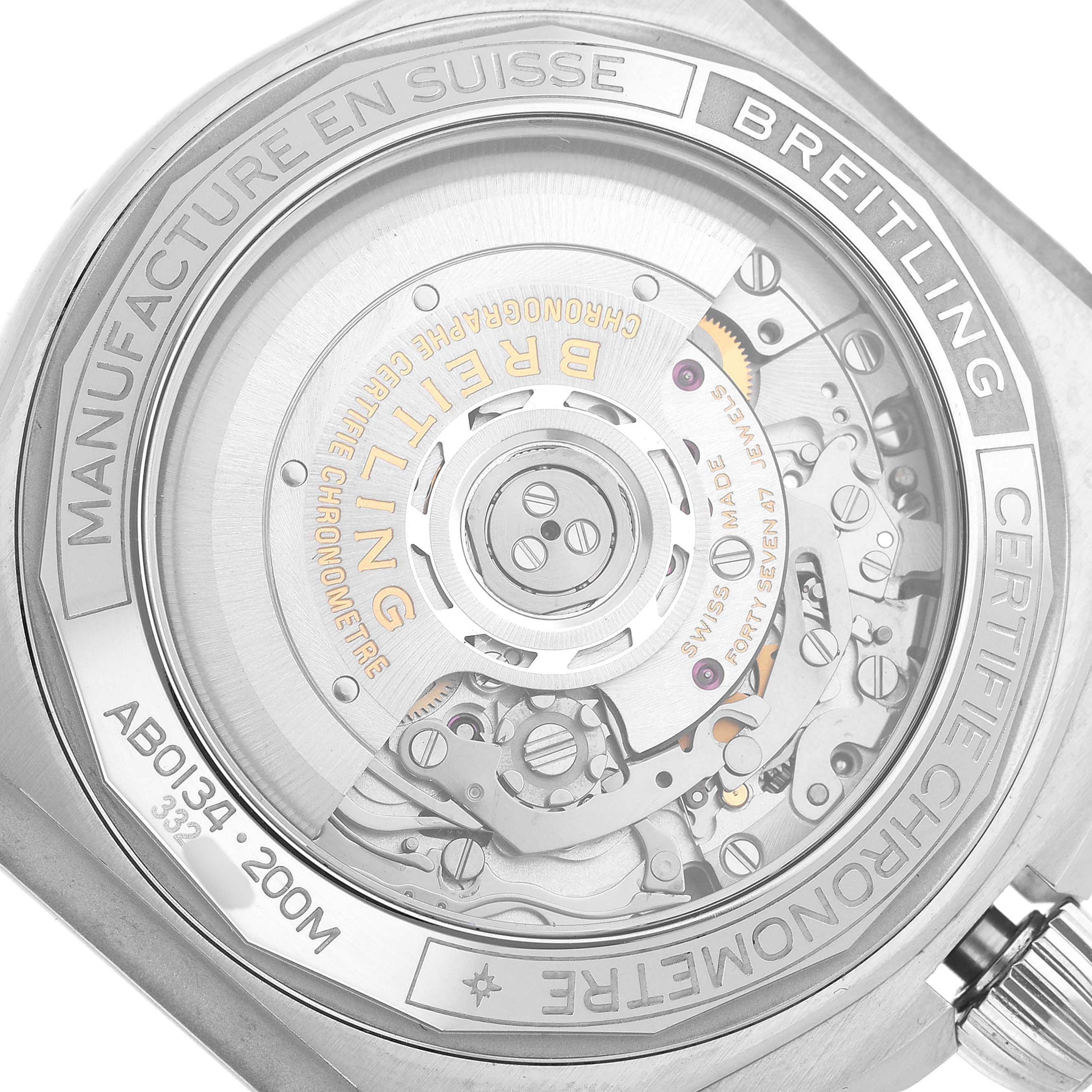 The image shows the back case of a Breitling Chronomat AB0134 Men's Stainless Steel Black Dial, revealing the intricate movement and parts inside.