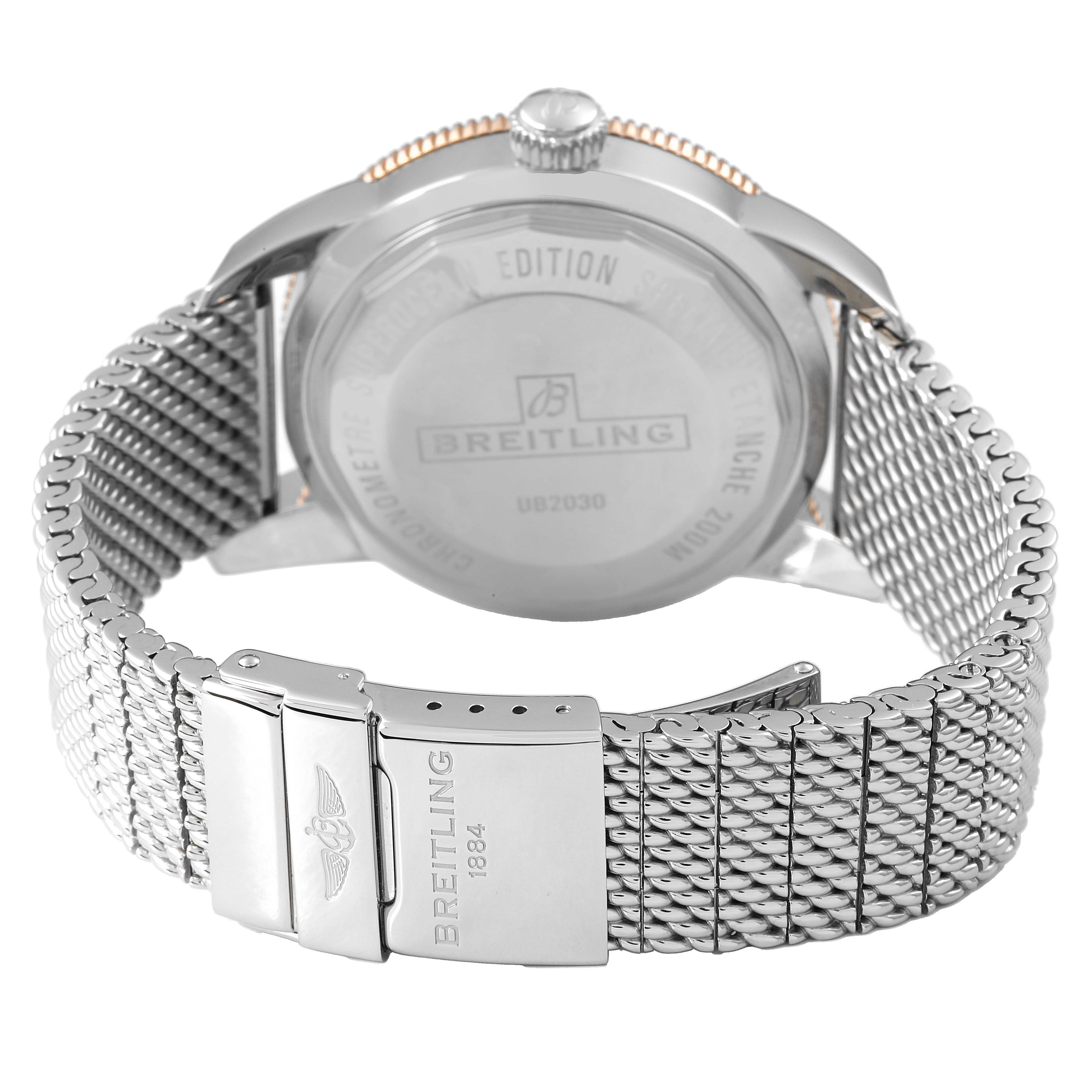 The image shows the back view of a Breitling Superocean UB2030121B1A1 Men's Stainless Steel Black Dial watch with its mesh bracelet and clasp displayed.