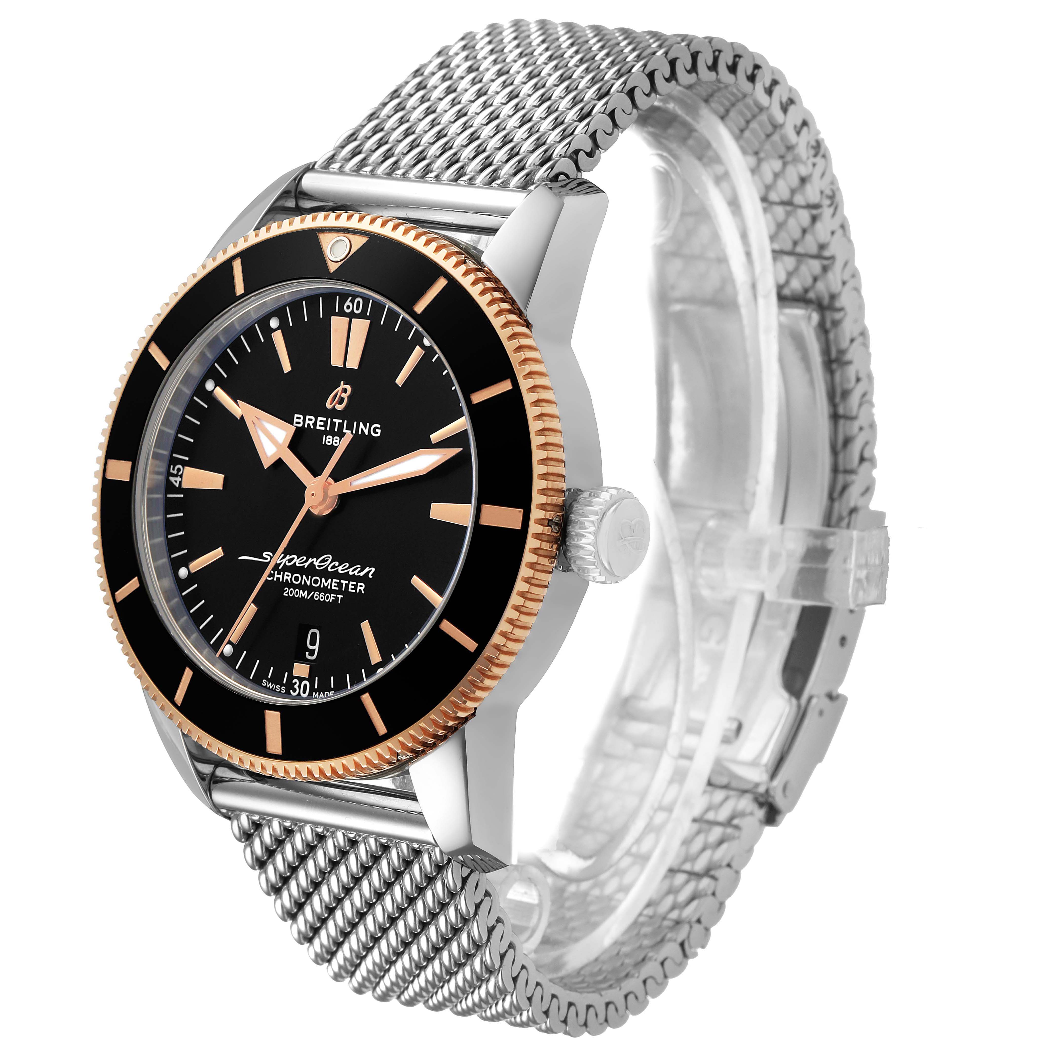 The Breitling Superocean UB2030121B1A1 Men's Stainless Steel Black Dial watch is shown from a front-side angle, highlighting the dial, bezel, crown, and mesh strap.