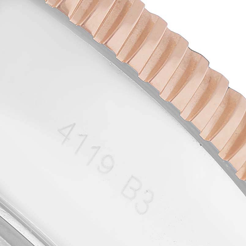 The image shows a close-up of the Breitling Superocean UB2030121B1A1 Men's Stainless Steel Black Dial's ridged bezel edge and part of the case with engraving.