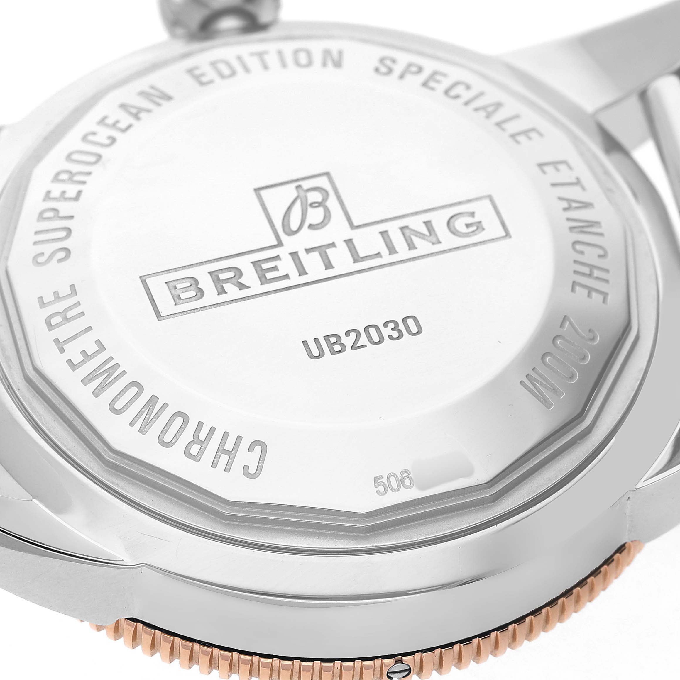 The image shows the back case of a Breitling Superocean UB2030121B1A1 Men's Stainless Steel Black Dial watch, highlighting the branding and model number.