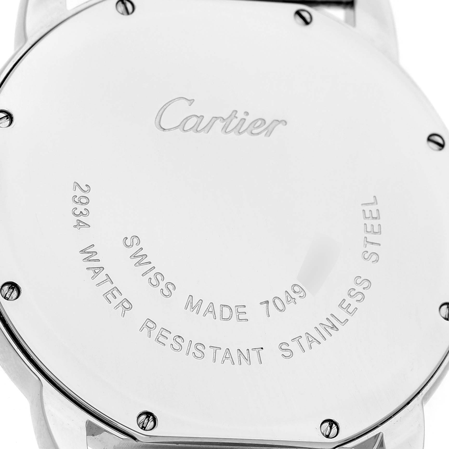 The image shows the back case of the Cartier Ronde W6700255 Men's Stainless Steel Silver Dial, focusing on its inscriptions and screws at a direct angle.