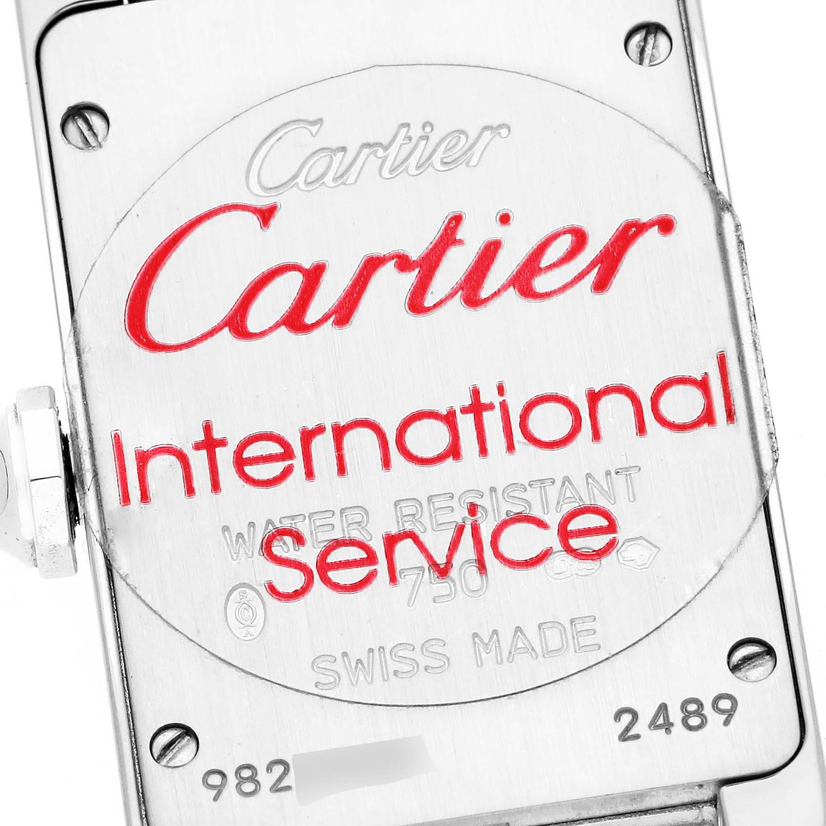This image shows the back case of the Tank Americaine model by Cartier, featuring brand engraving and model details.
