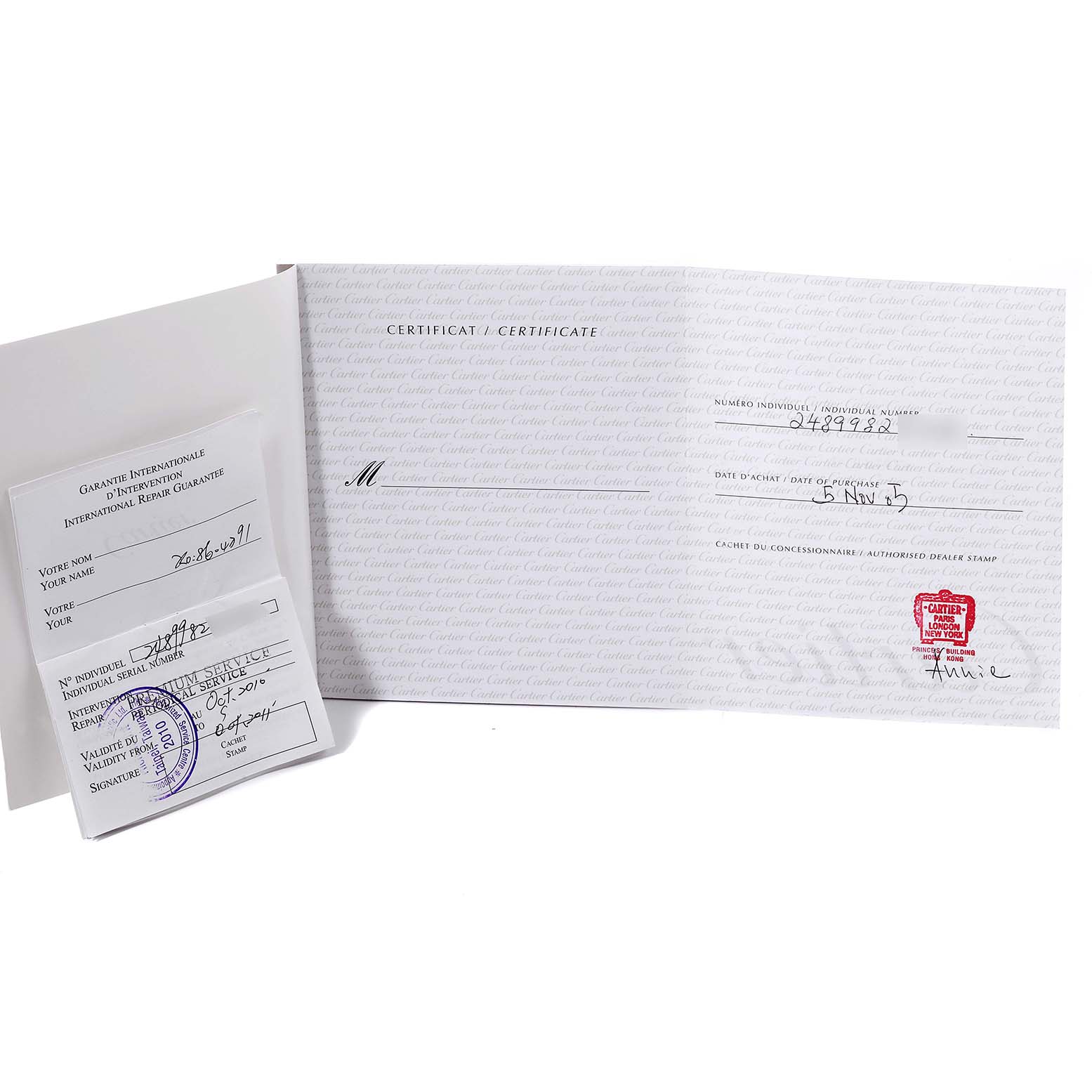 This image shows the certificate and warranty documents for the Cartier Tank Americaine WB7073L1 Women's White Gold Silver Dial WB7073L1 Women's White Gold Silver Dial watch.