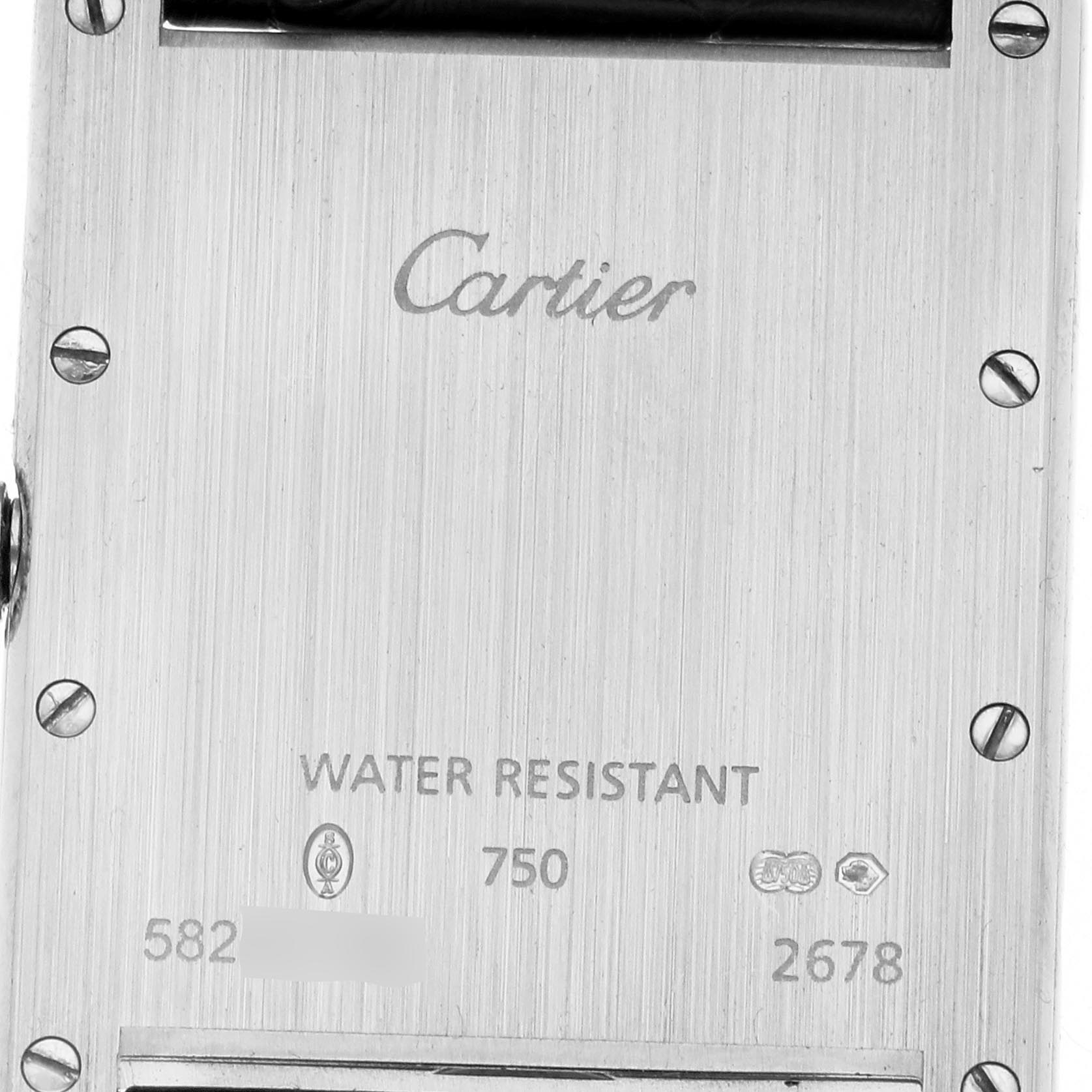 The image shows the back of the Cartier Tank Louis W1540956 Men's White Gold Silver Dial W1540956 Men's White Gold Silver Dial watch, highlighting the brand inscription and serial details.