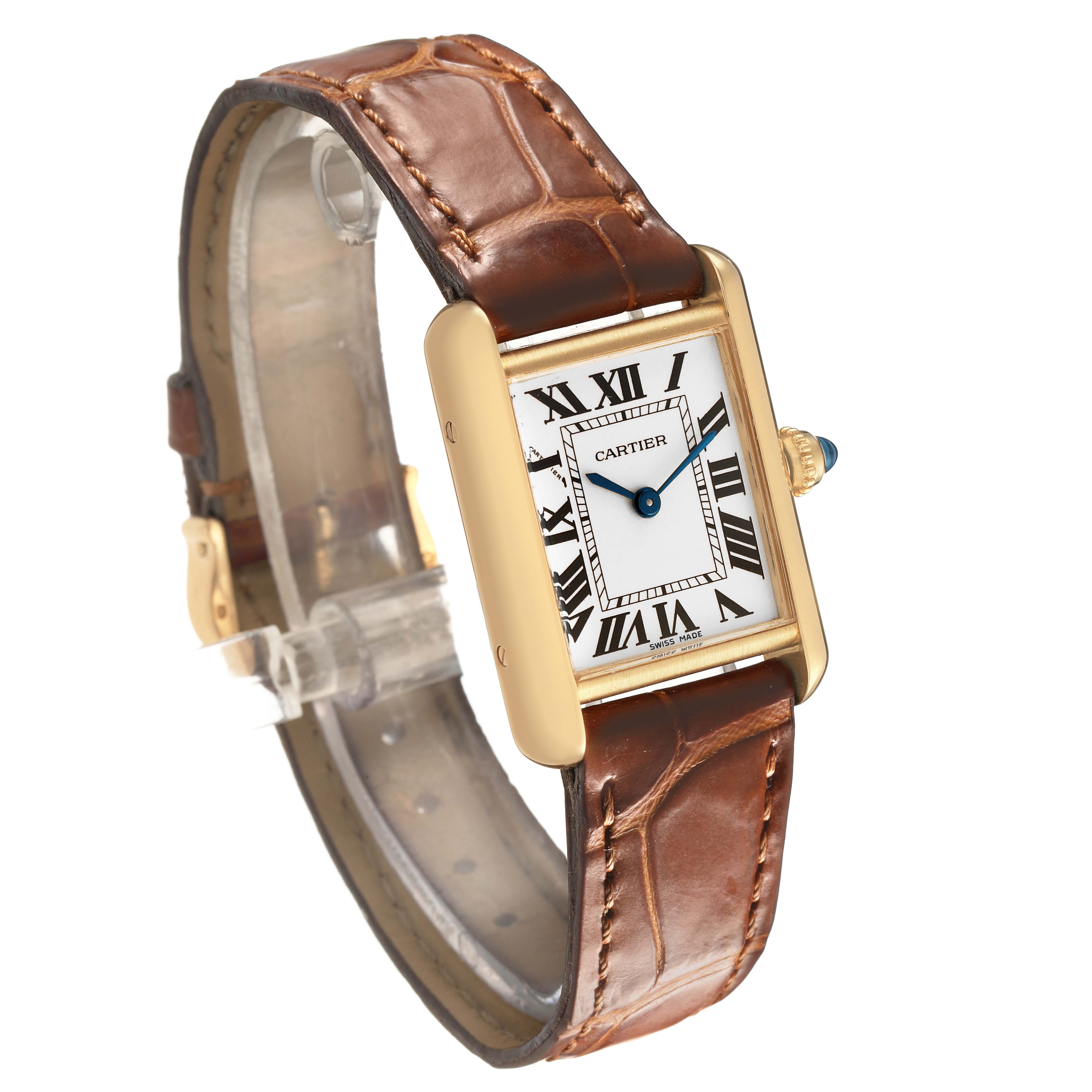 The Cartier Tank Louis W1529856 Women's Yellow Gold Silver Dial watch is shown from a three-quarter angle, displaying the face, leather strap, and side crown.