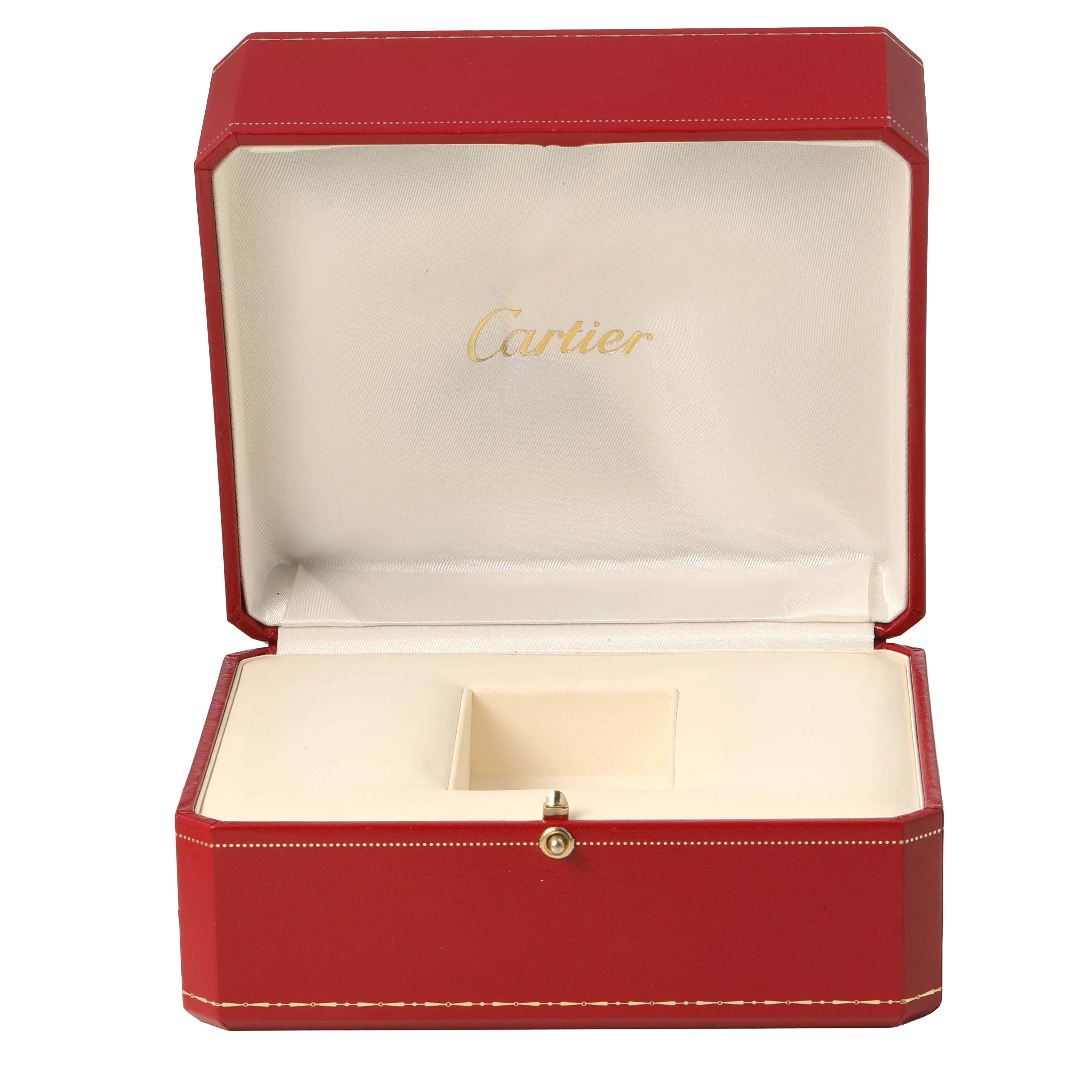 The image shows an open Cartier Tank MC WSTA0010 Men's Stainless Steel Brown Dial watch box, angled to display its red exterior and cream interior.