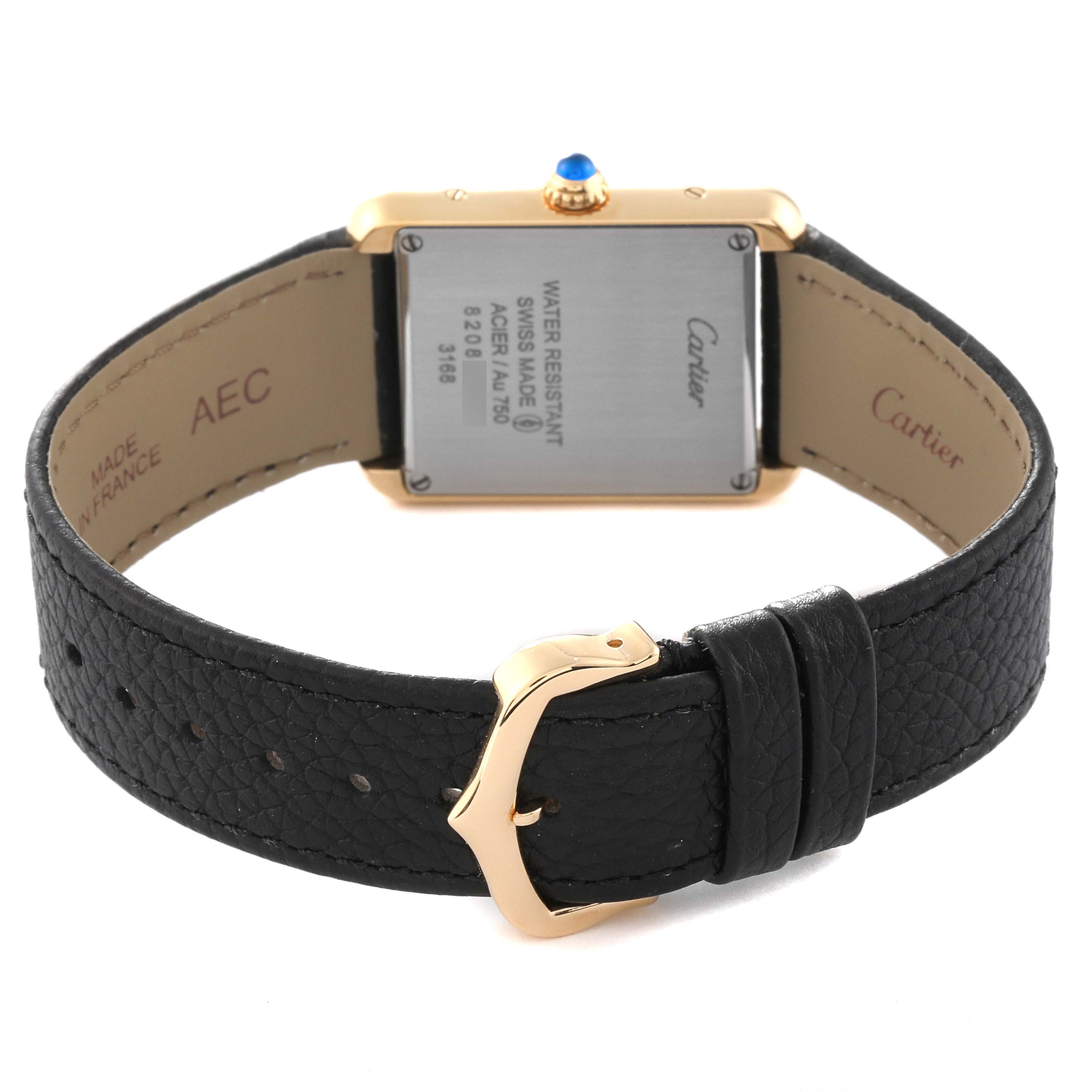 The image shows the back view of the Cartier Tank Solo W5200002 Women's Steel and Gold (two tone) Silver Dial W5200002 Women's Steel and Gold (two tone) Silver Dial watch, highlighting its leather strap and metallic buckle.