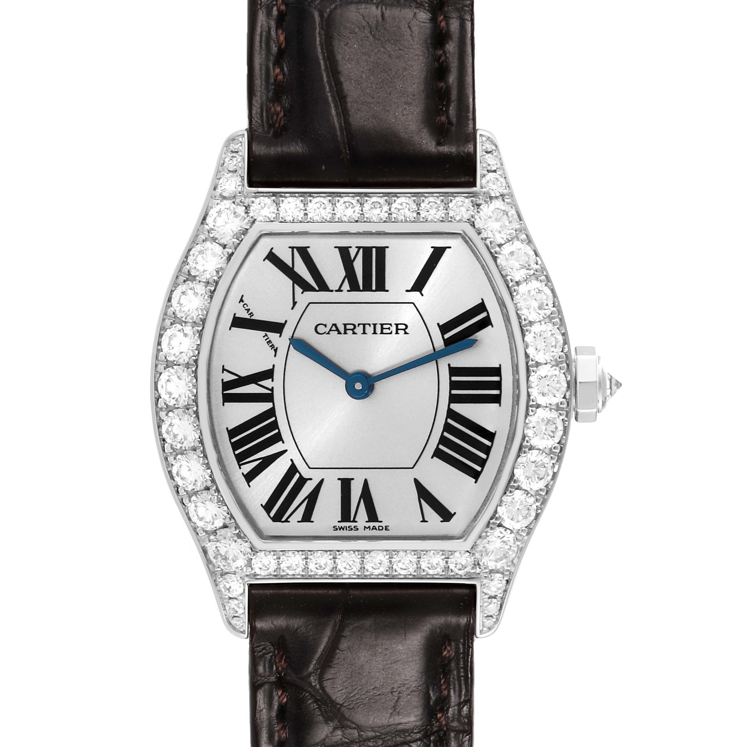 The Cartier Tortue WA507231 Women's White Gold Silver Dial watch is shown front-facing, highlighting its dial, diamond bezel, and leather strap.