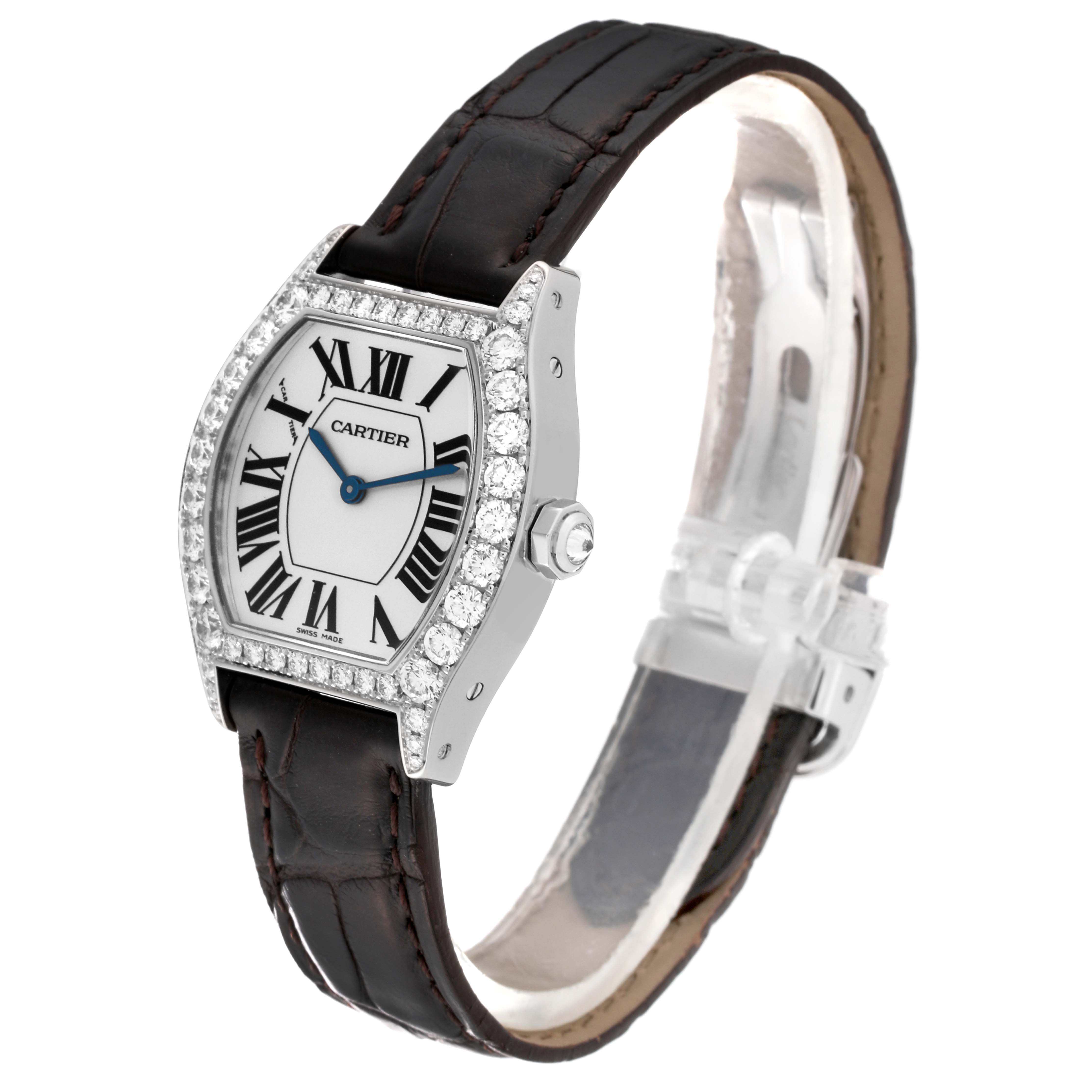 The Cartier Tortue WA507231 Women's White Gold Silver Dial WA507231 Women's White Gold Silver Dial watch is shown from an angled top-side perspective, highlighting the face, bezel, and leather strap.