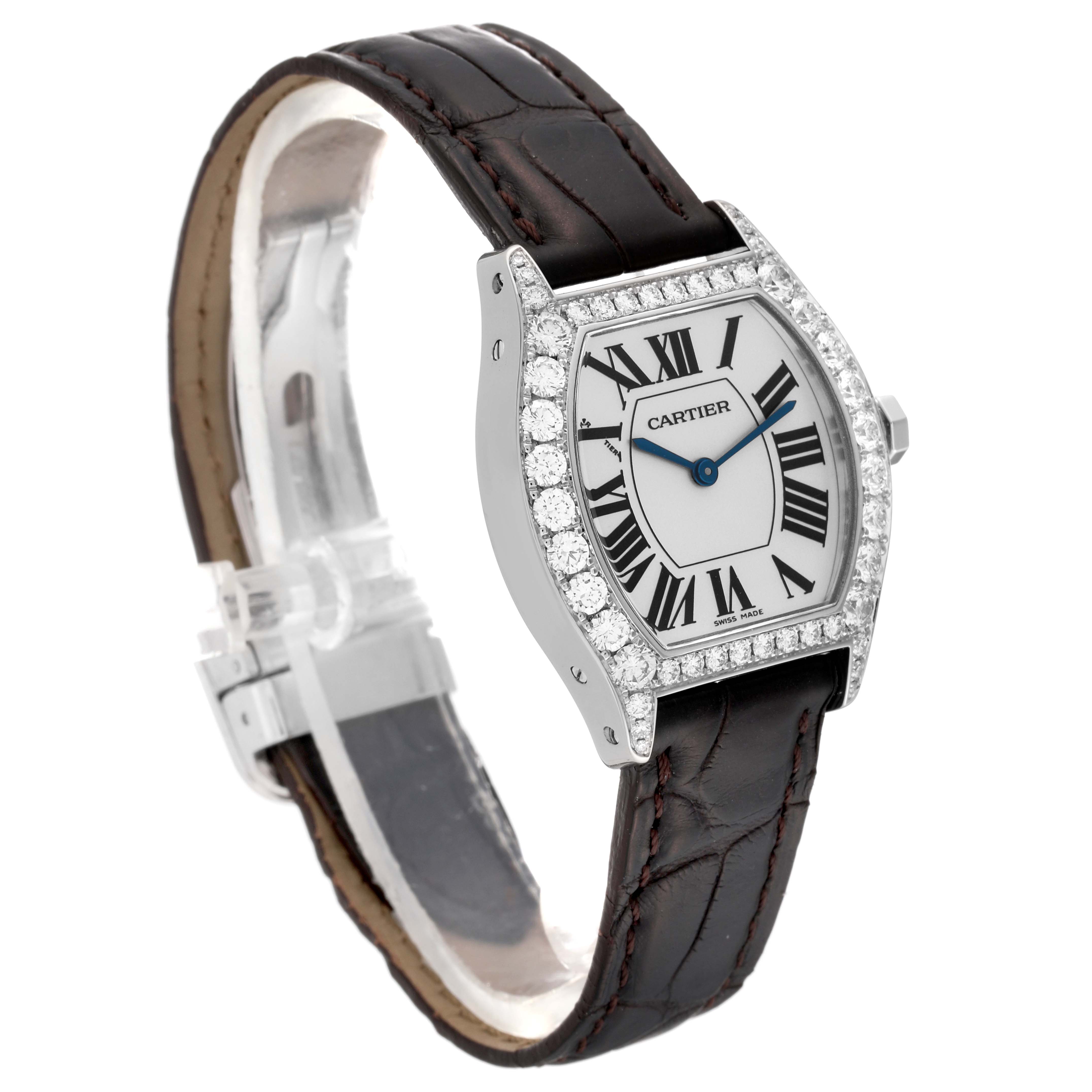 The Cartier Tortue WA507231 Women's White Gold Silver Dial WA507231 Women's White Gold Silver Dial watch is shown at an angle displaying its face, bezel with diamonds, and leather strap.