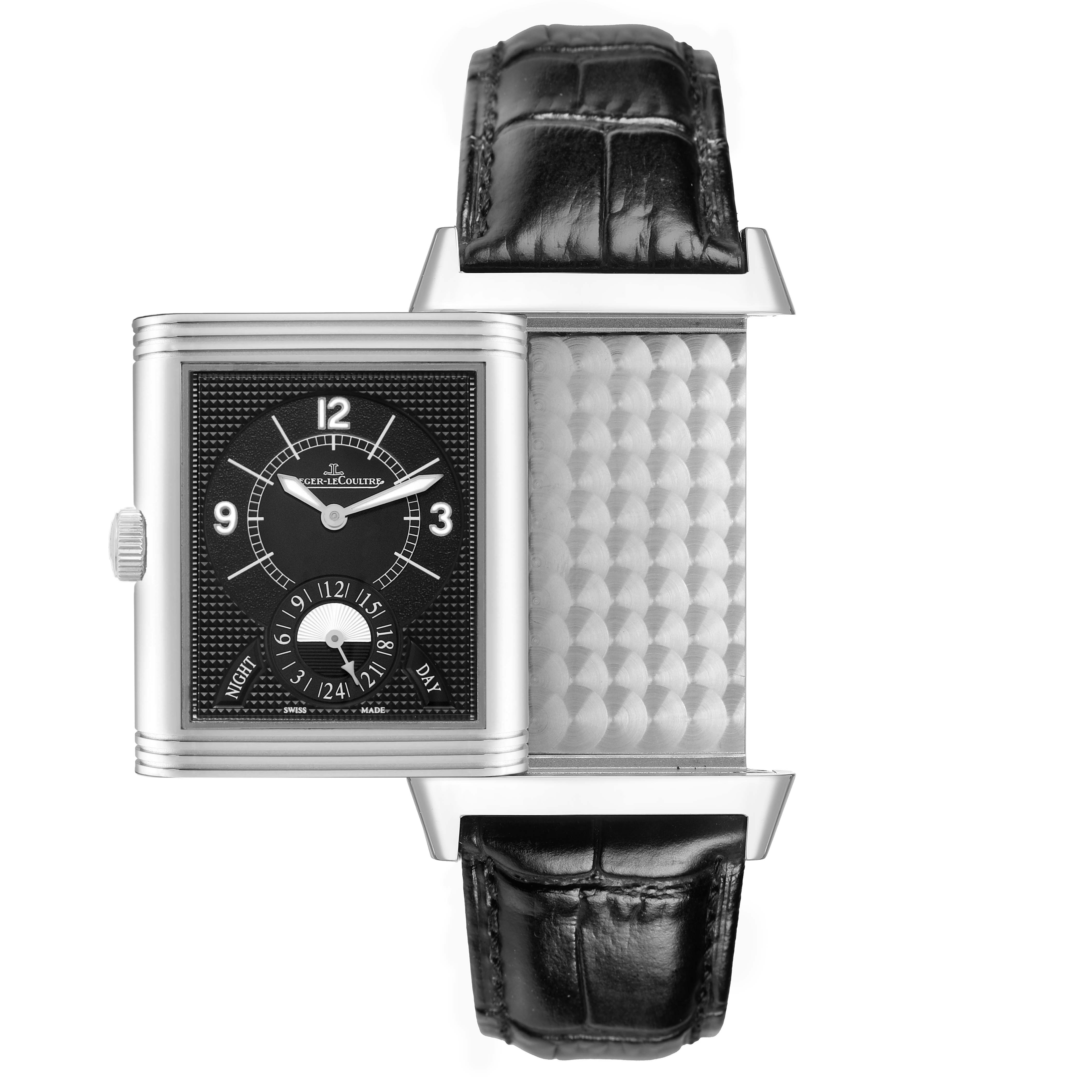 The image shows a Jaeger-LeCoultre Reverso watch partially flipped, revealing both the dial and engraved reverse side.