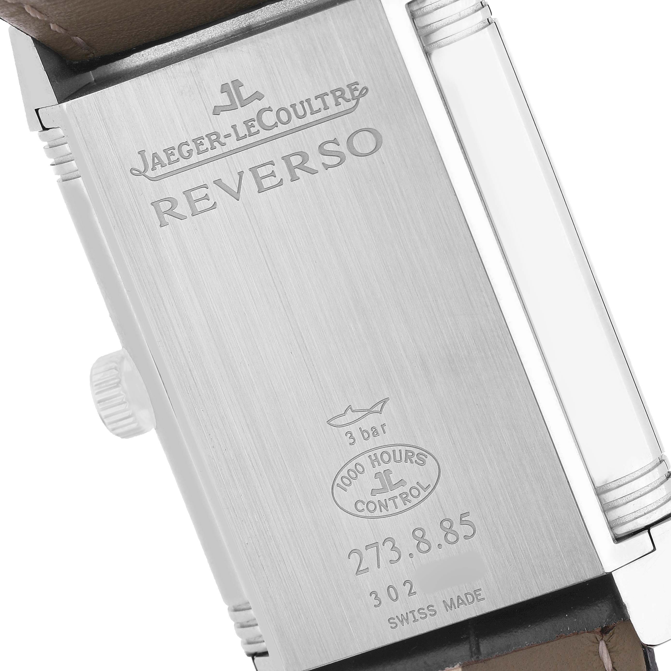 The image shows the back of the Jaeger-LeCoultre Reverso, highlighting engravings and a portion of the strap.