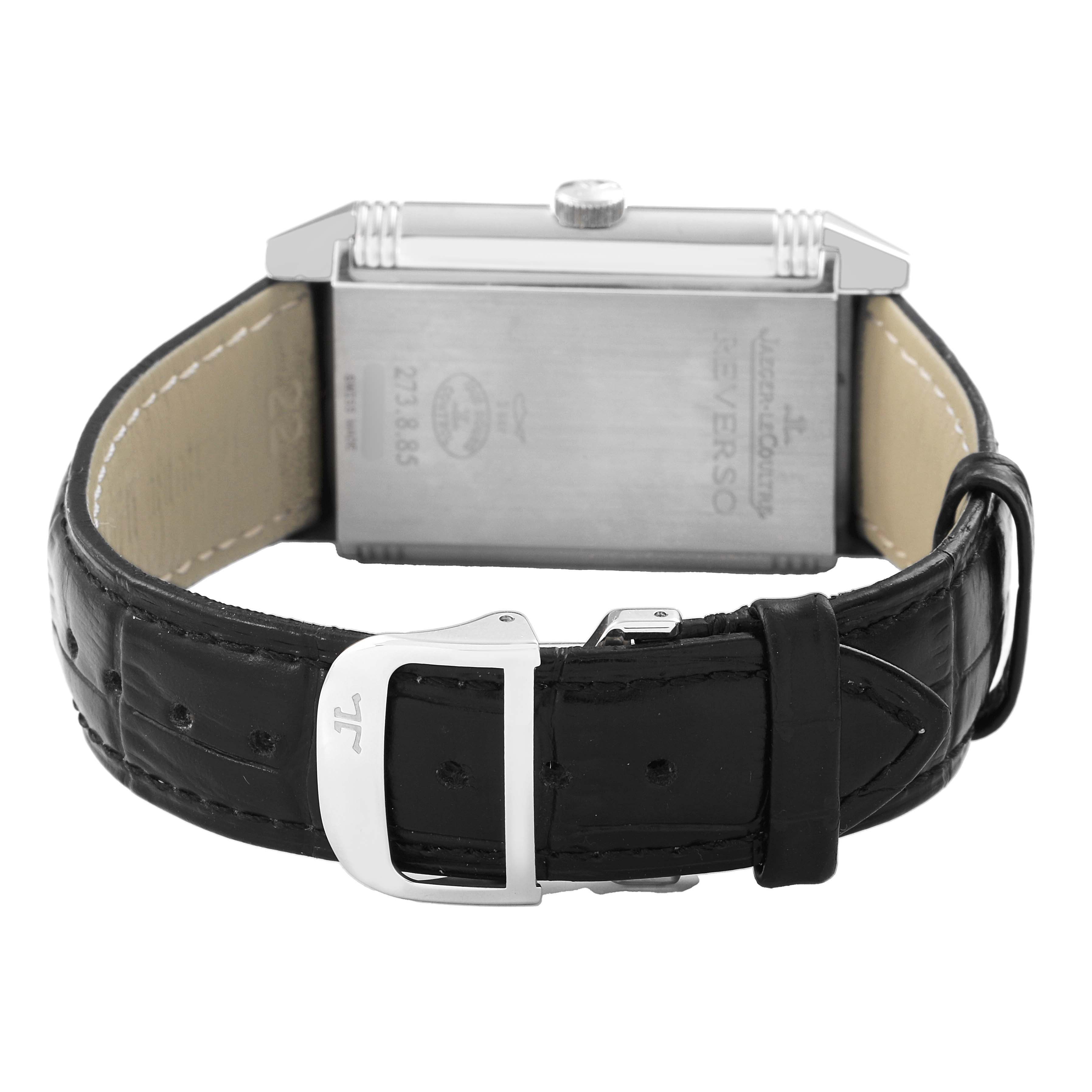 The image shows the back of a Jaeger LeCoultre Reverso Q3748421 / 273.8.85 Men's Stainless Steel Silver Dial watch with a black leather strap and a visible buckle.