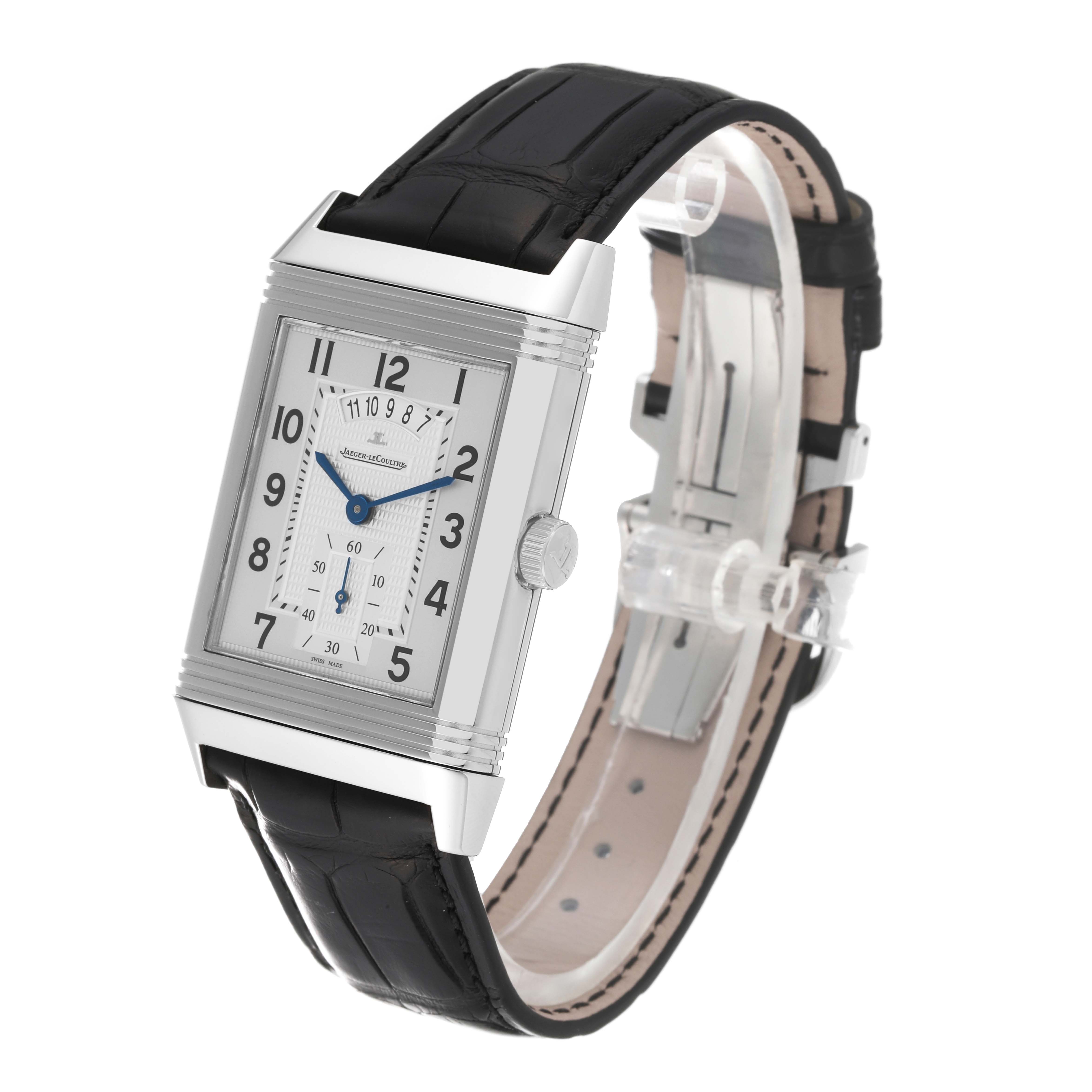The Reverso model by Jaeger LeCoultre is shown at a slight angle, displaying the watch face, crown, and part of the leather strap.