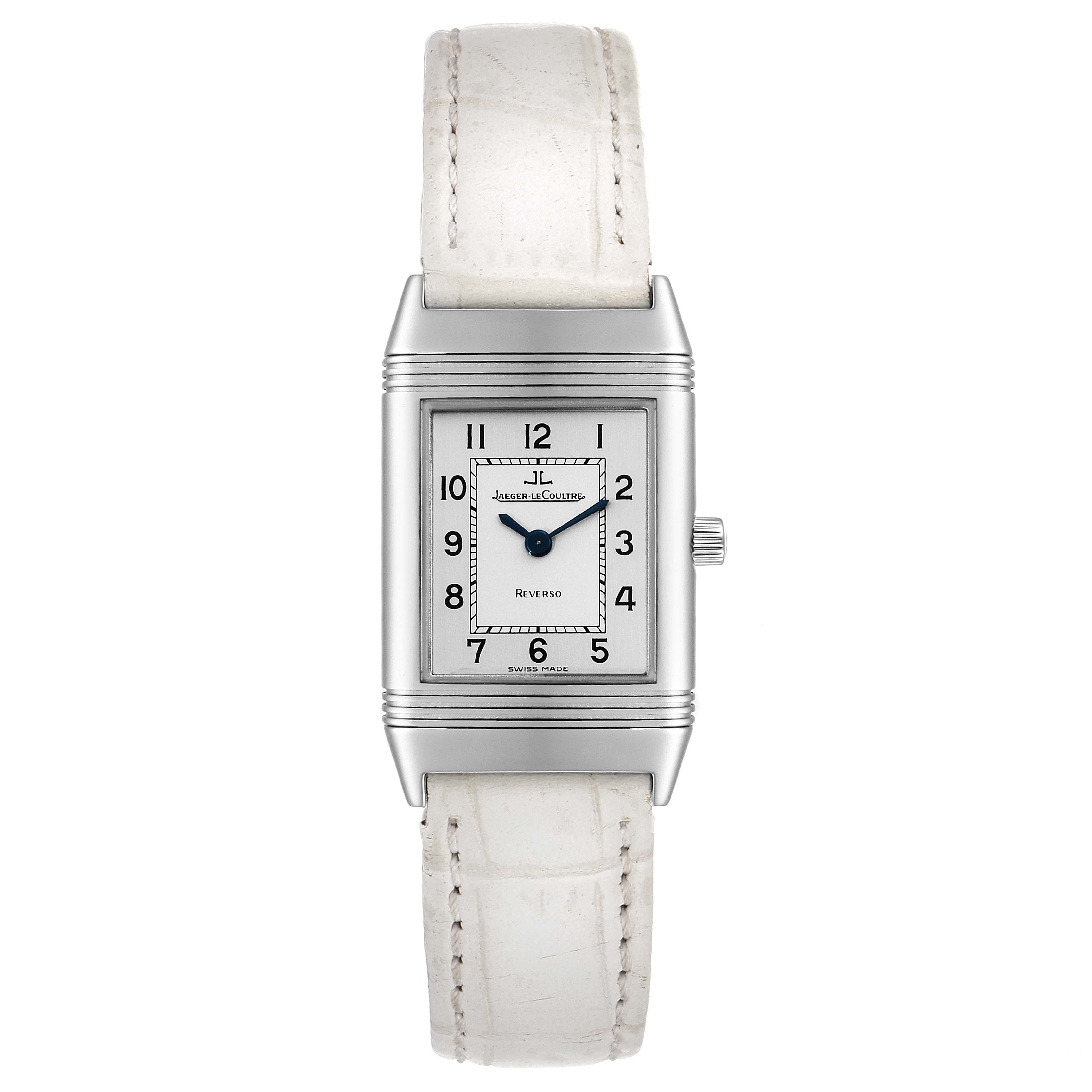 The image shows a front view of a Jaeger LeCoultre Reverso 260.8.08 Women
s Stainless Steel Silver Dial 260.8.08 Women
s Stainless Steel Silver Dial watch with a white strap and silver rectangular case.
