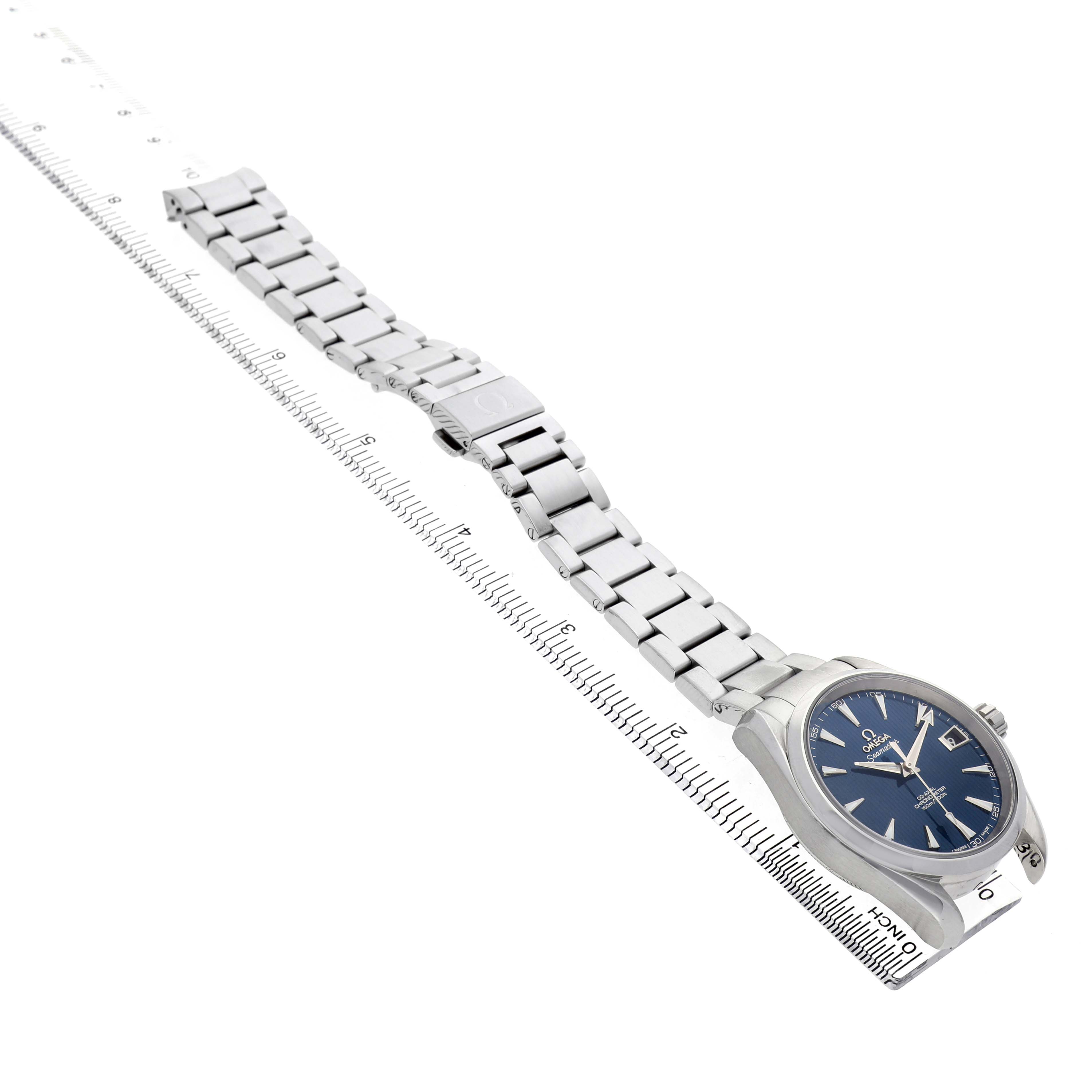 The image shows an Omega Aqua Terra 231.10.39.21.03.001 Men's Stainless Steel Blue Dial watch laid horizontally, displaying the dial, case, and full bracelet alongside a ruler.