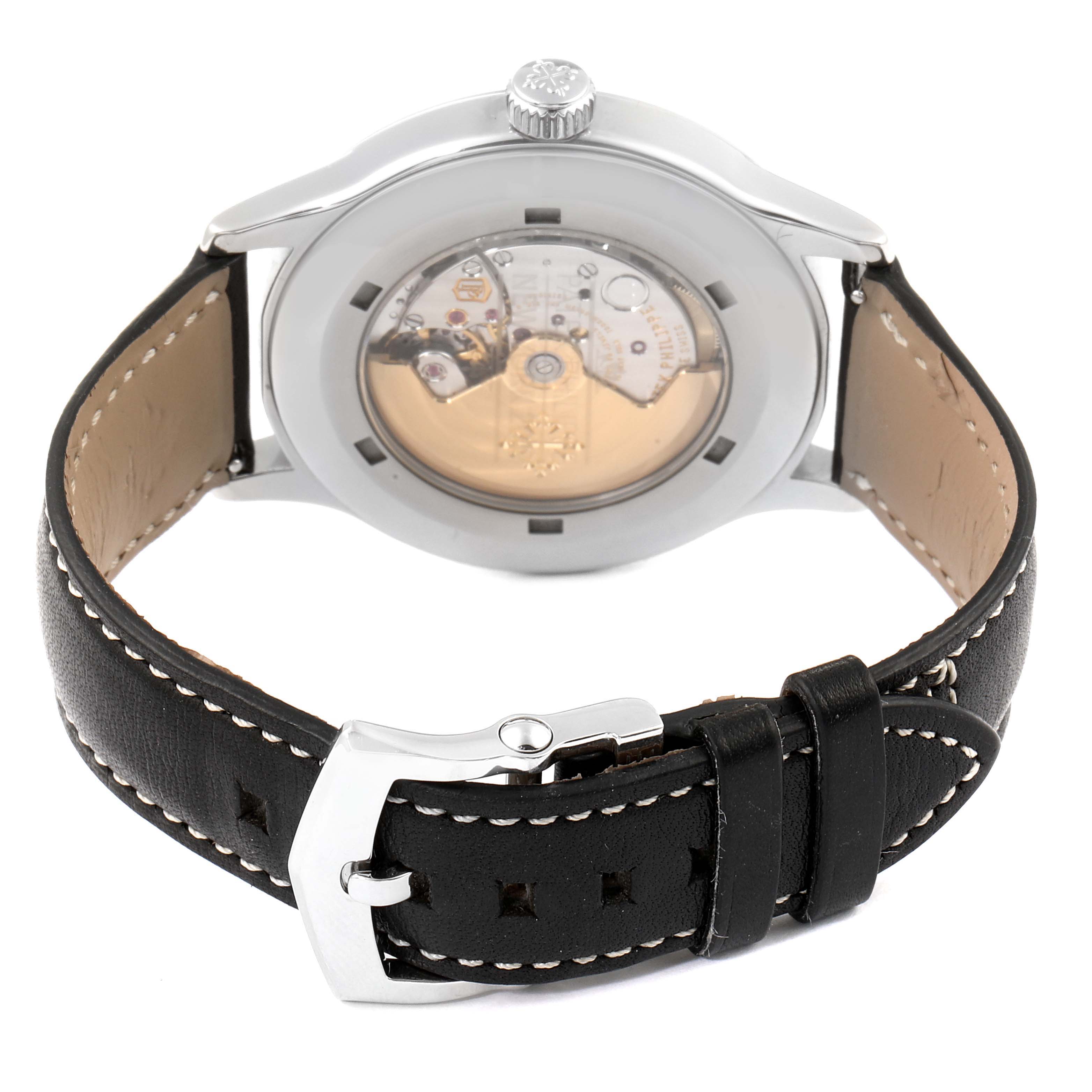 This image shows the back view of a Patek Philippe Calatrava 5522A - 001 Men's Stainless Steel Blue Dial 5522A - 001 Men's Stainless Steel Blue Dial watch, displaying its movement and black leather strap.