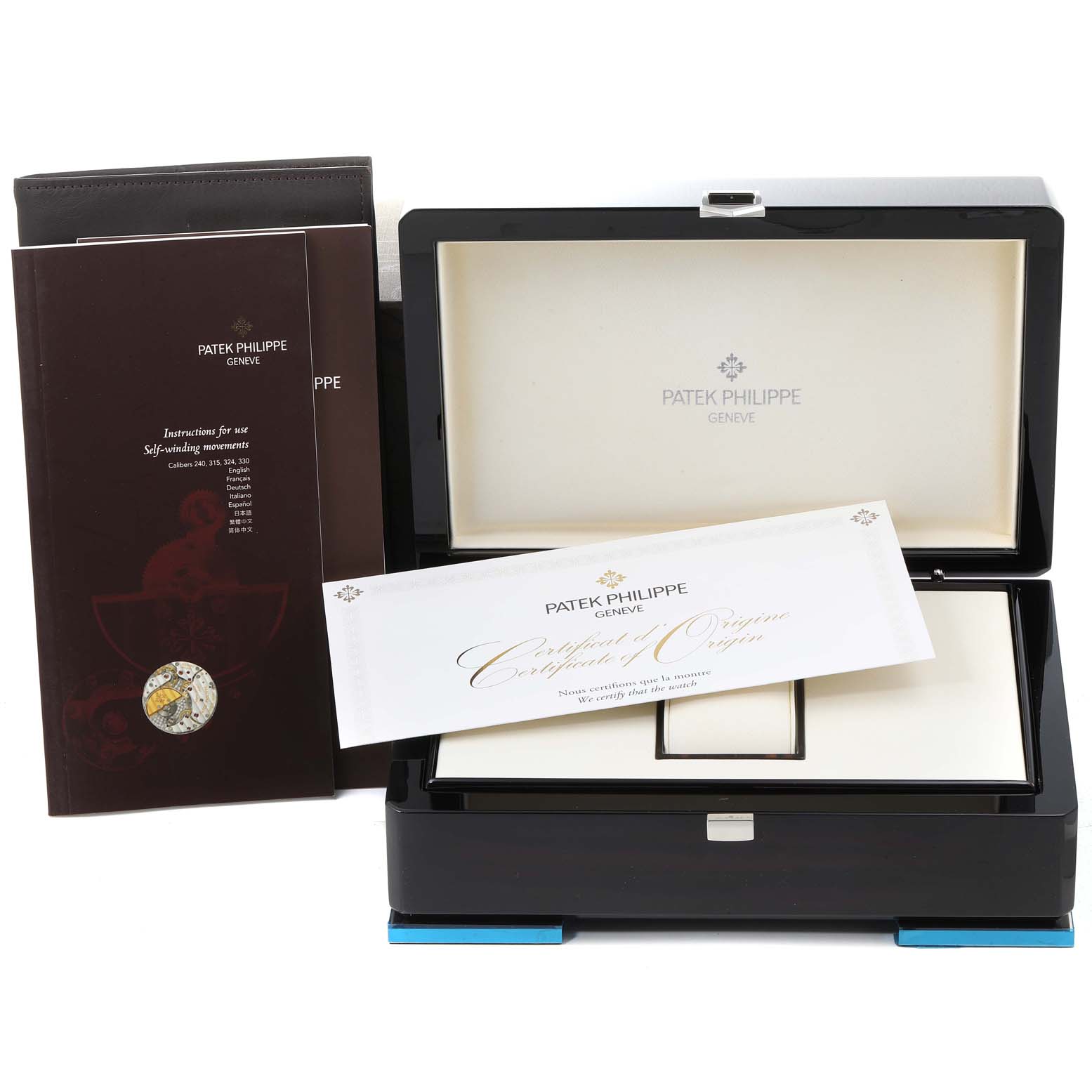 The image shows the packaging, certificate, instruction manual, and open box for a Patek Philippe Calatrava 5522A - 001 Men's Stainless Steel Blue Dial 5522A - 001 Men's Stainless Steel Blue Dial watch.