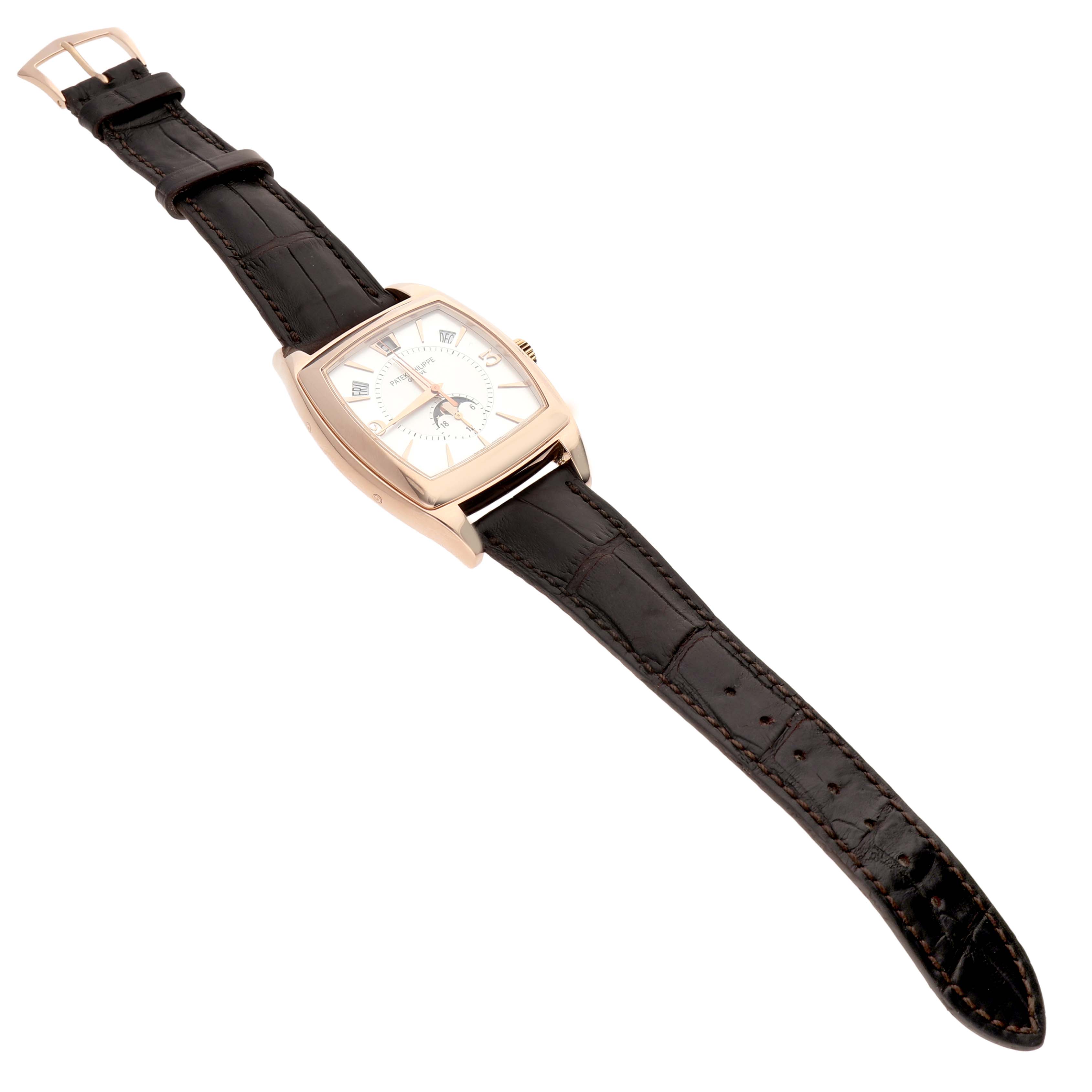 The Patek Philippe Gondolo 5135R-001 Men's Rose Gold Silver Dial watch is shown at a slight angle, highlighting its square case, white dial, and brown leather strap.