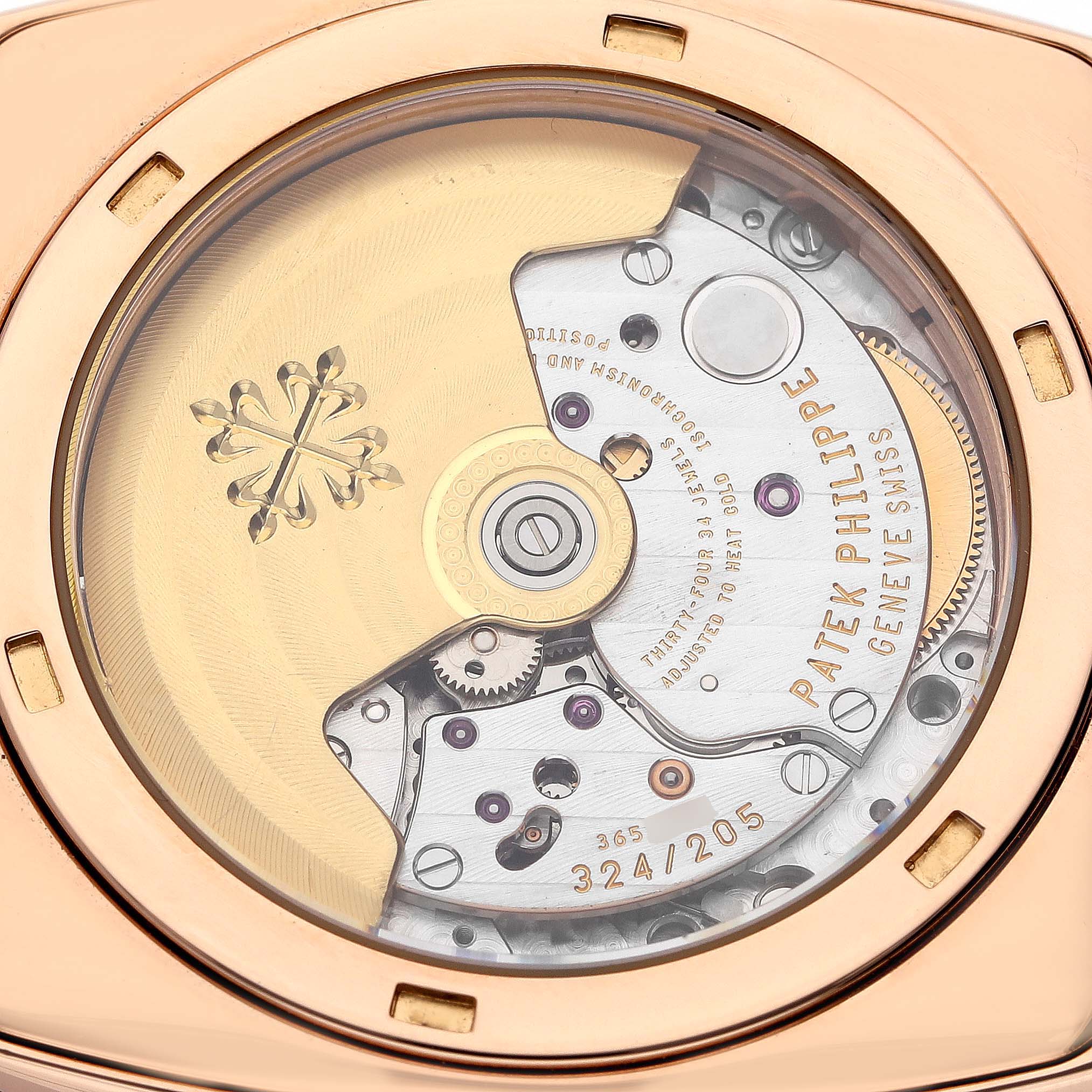The image shows the back view of the Patek Philippe Gondolo 5135R-001 Men's Rose Gold Silver Dial, displaying its movement and intricate mechanics.