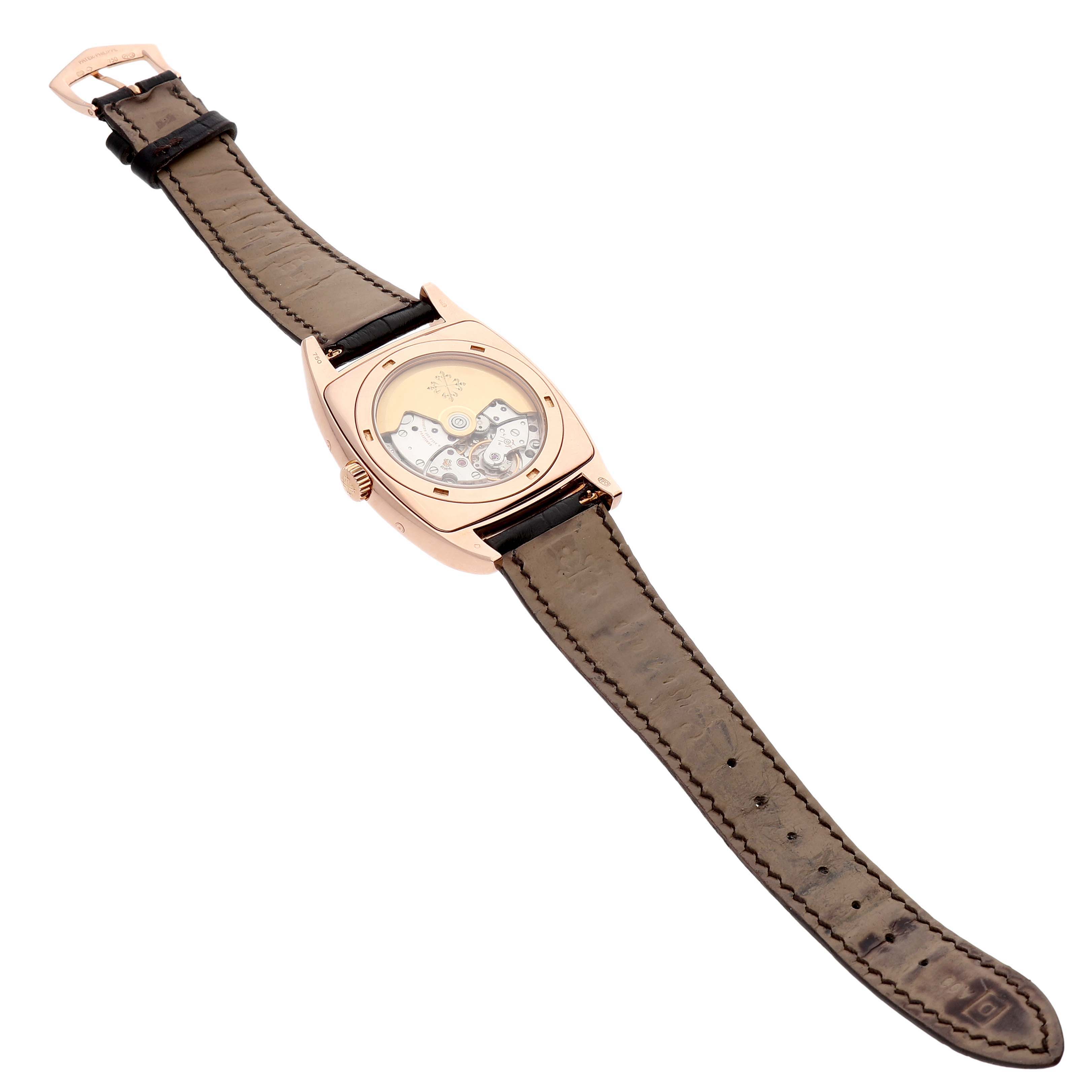 The Patek Philippe Gondolo 5135R-001 Men's Rose Gold Silver Dial watch is shown from the back, revealing the movement and the full leather strap.