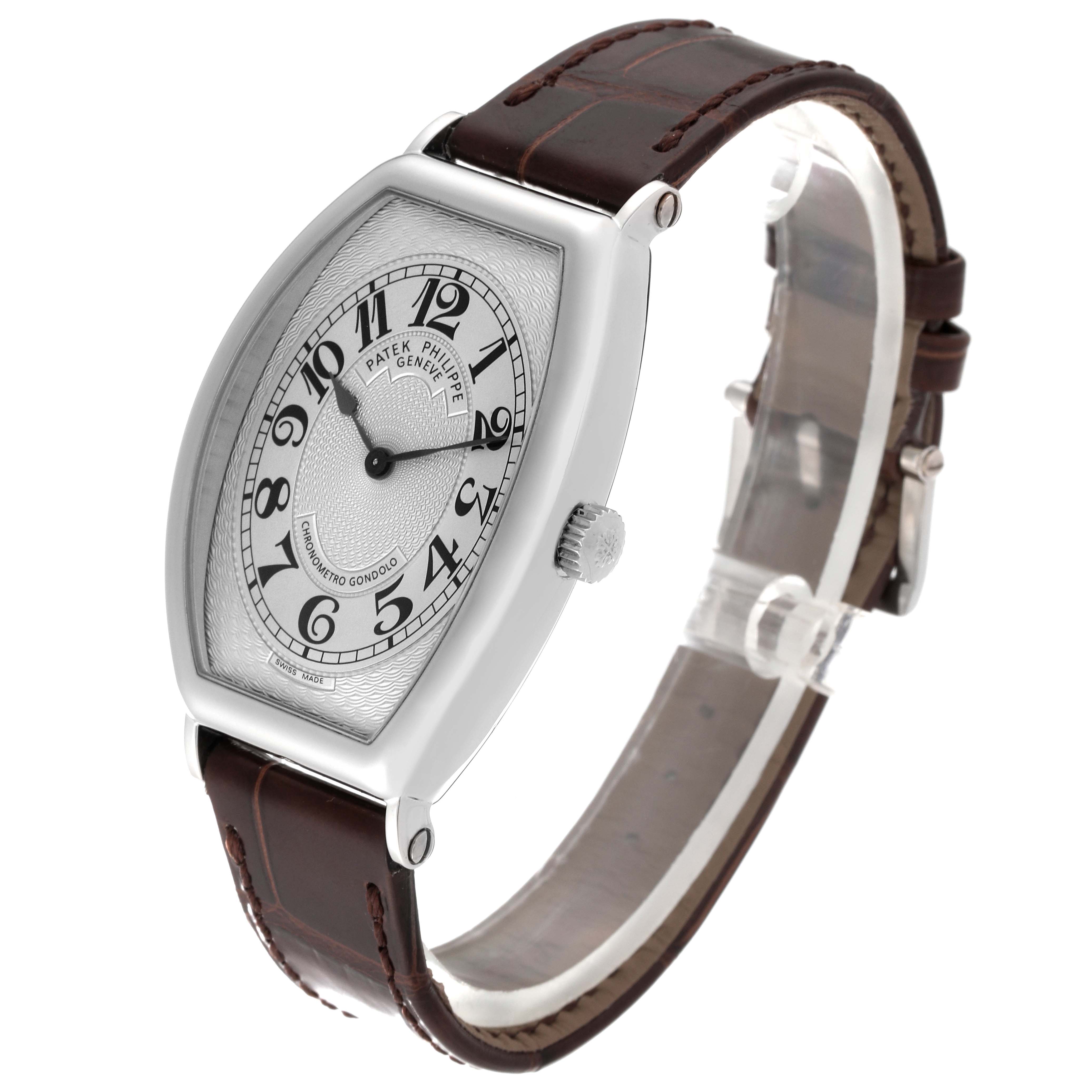 The image shows a three-quarter side view of the Patek Philippe Gondolo 5098P-001 Men's Platinum Silver Dial 5098P-001 Men's Platinum Silver Dial watch, highlighting its dial, crown, and leather strap.