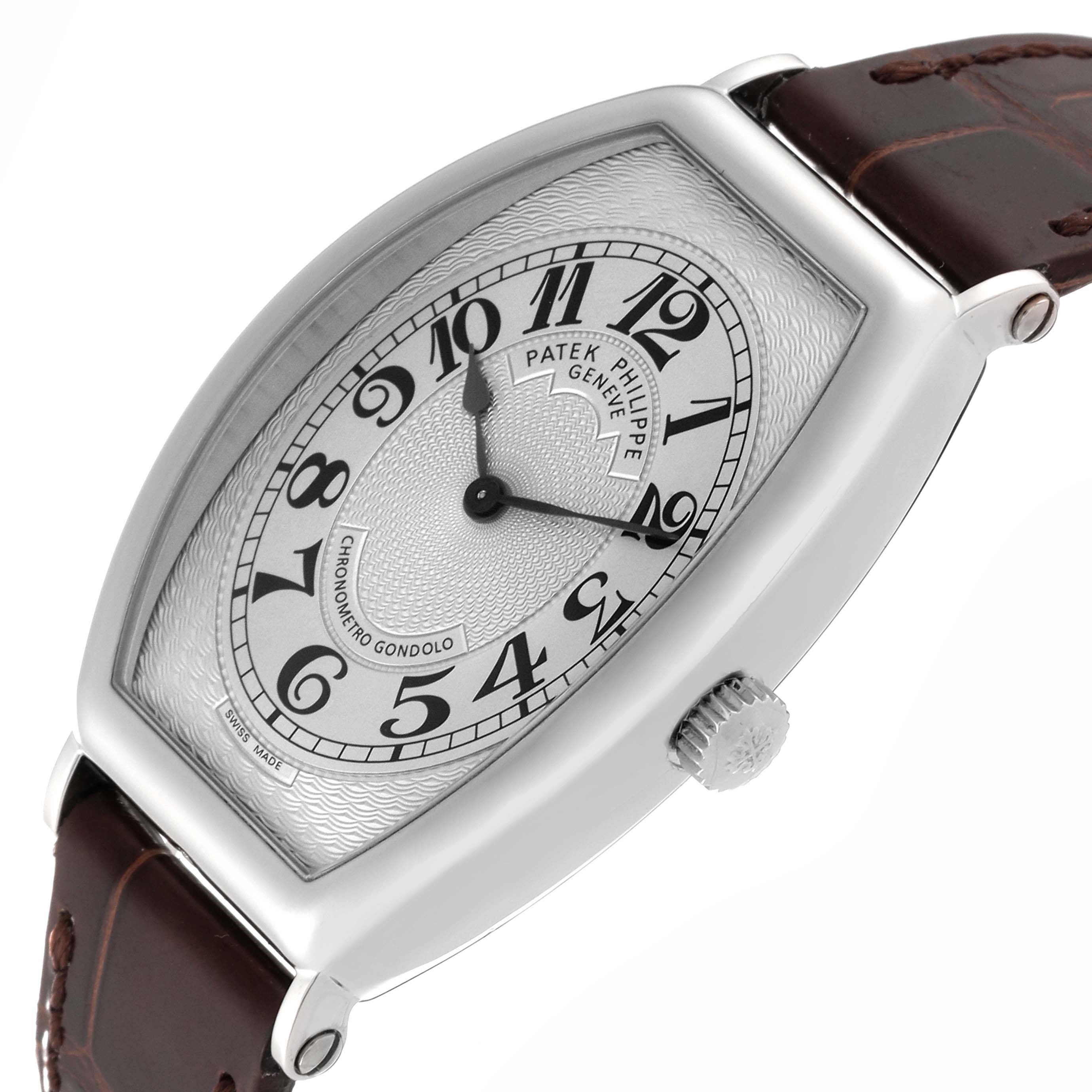 The image shows a Patek Philippe Gondolo 5098P-001 Men's Platinum Silver Dial 5098P-001 Men's Platinum Silver Dial watch from an angled side view, displaying its dial, crown, and leather strap.