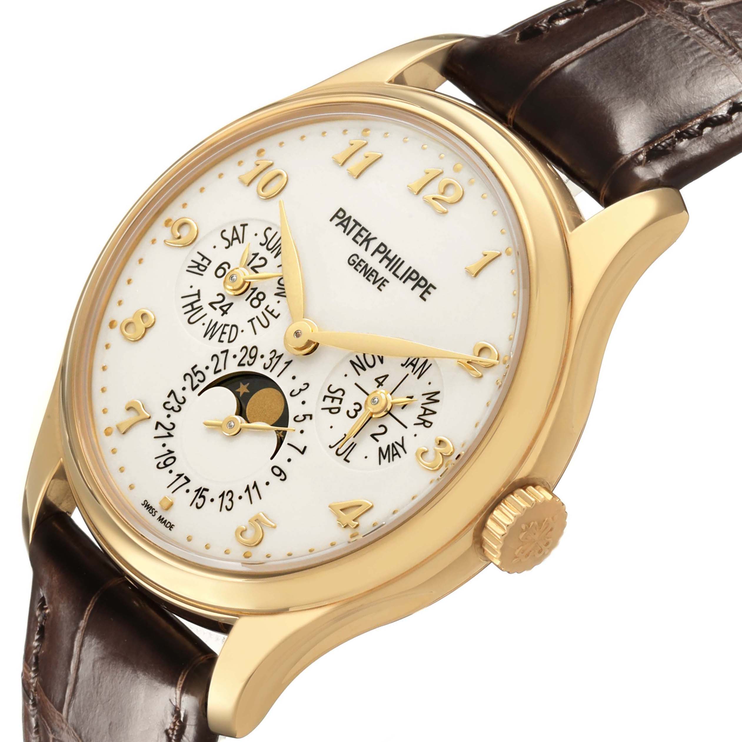 The Patek Philippe Complications 5327J-001 Men's Yellow Gold Beige Dial watch is shown at an angled side view, displaying the face, gold case, crown, and leather strap.