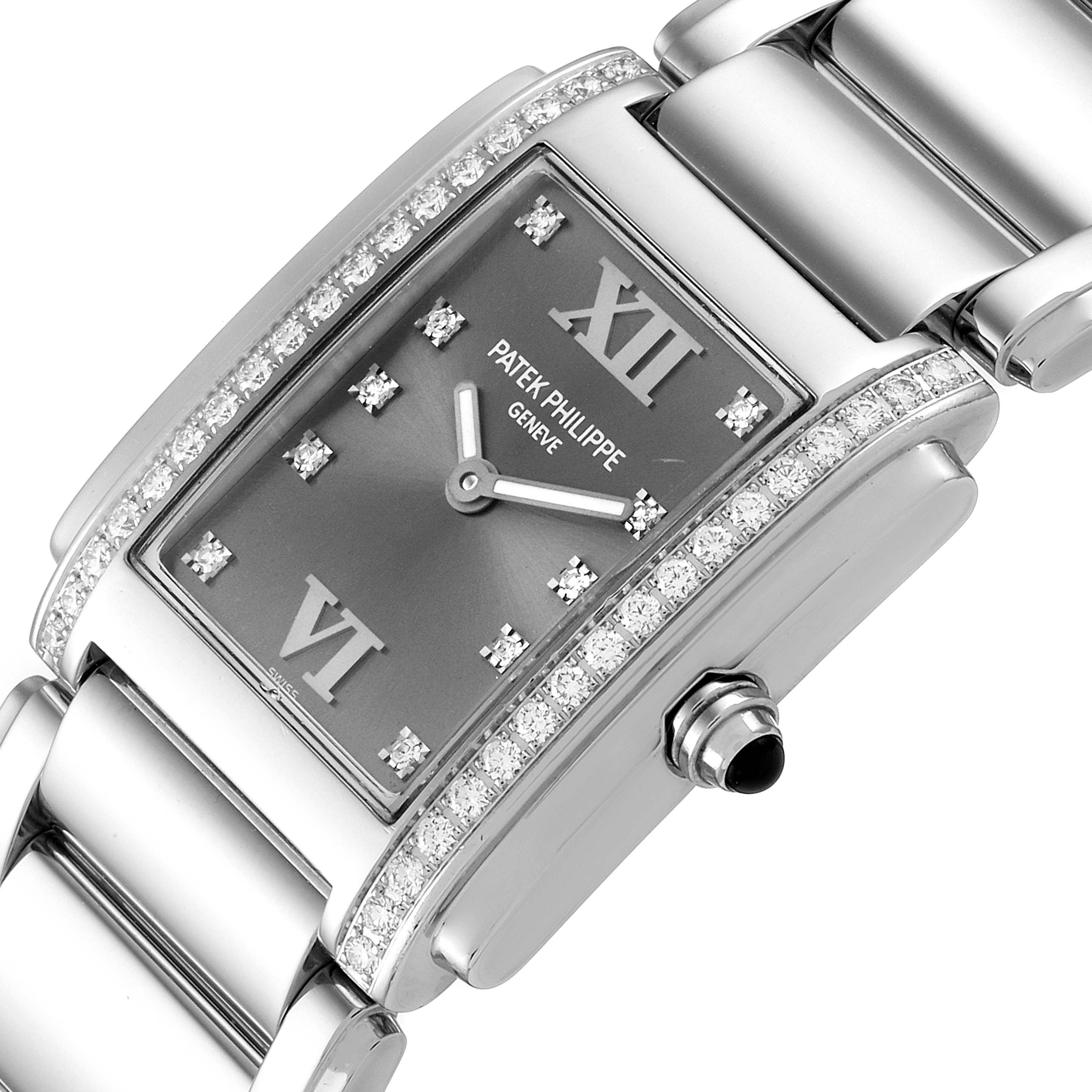 This image shows a close-up angle of the Patek Philippe Twenty-4 4910/10A-010 Women's Stainless Steel Grey Dial 4910/10A-010 Women's Stainless Steel Grey Dial watch, highlighting its face, bracelet, and crown.