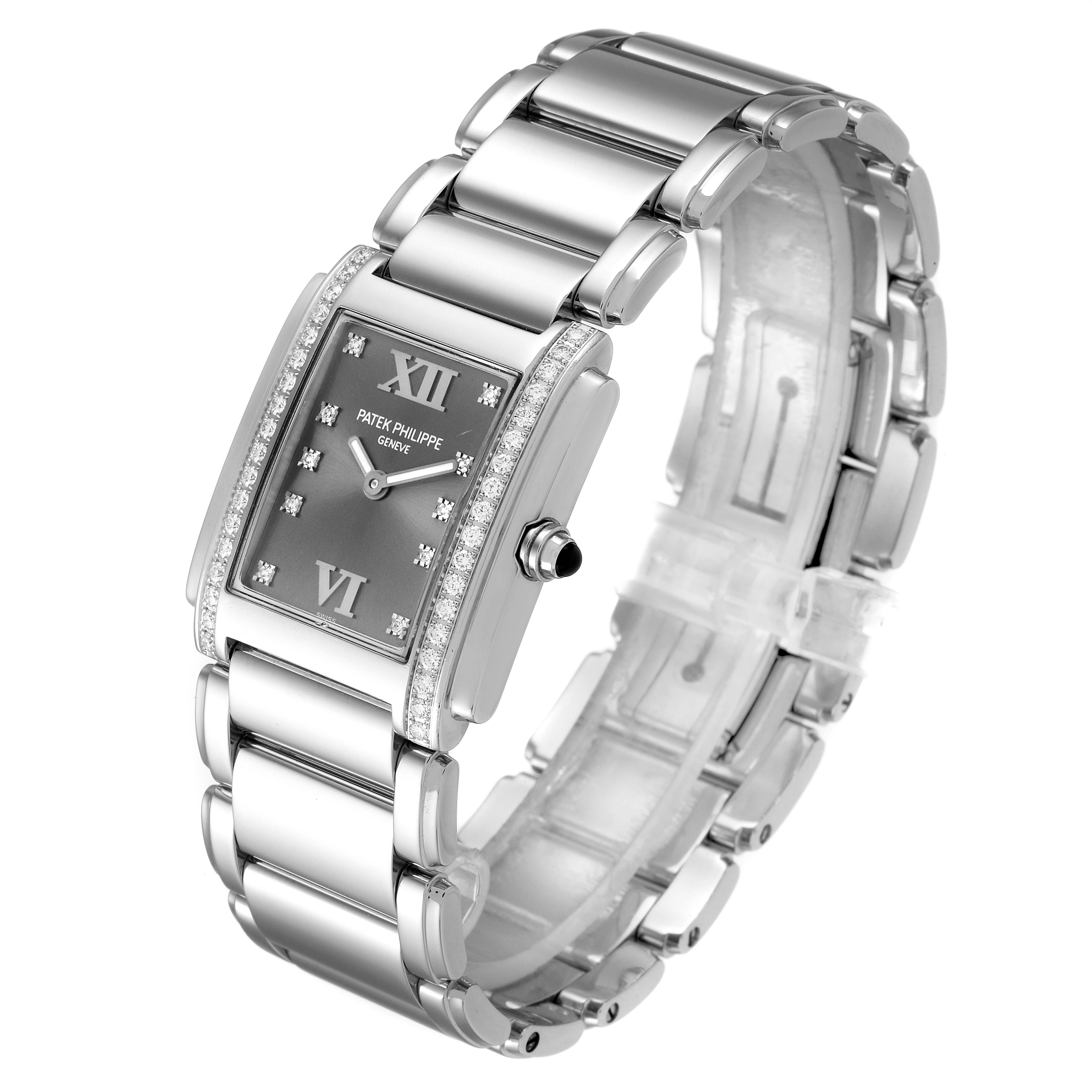 This image shows the Patek Philippe Twenty-4 4910/10A-010 Women's Stainless Steel Grey Dial 4910/10A-010 Women's Stainless Steel Grey Dial watch from a three-quarter view, displaying the face, case, bracelet, and crown.