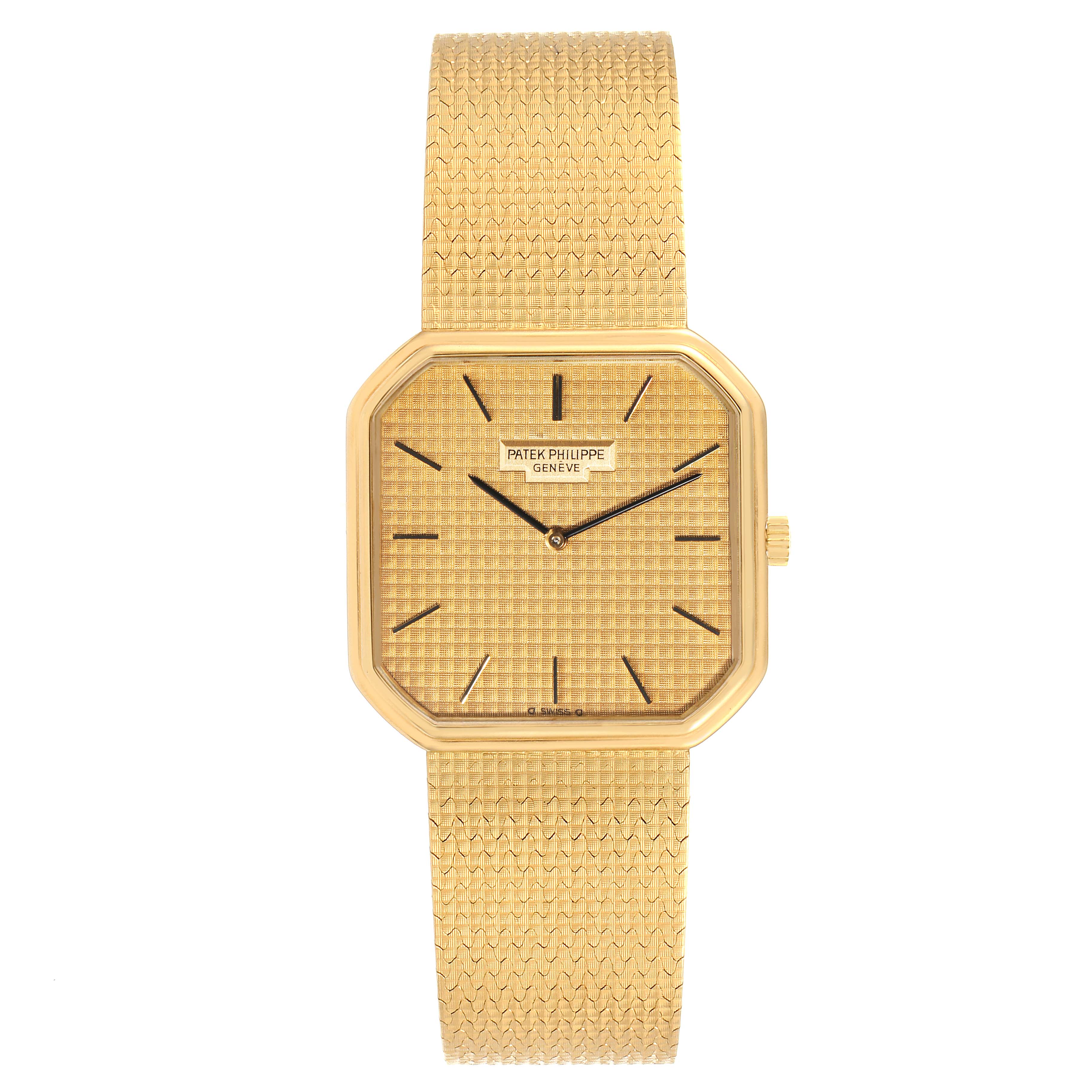 The image shows a front view of a Vintage Patek Philippe watch with a gold mesh band and octagonal face.