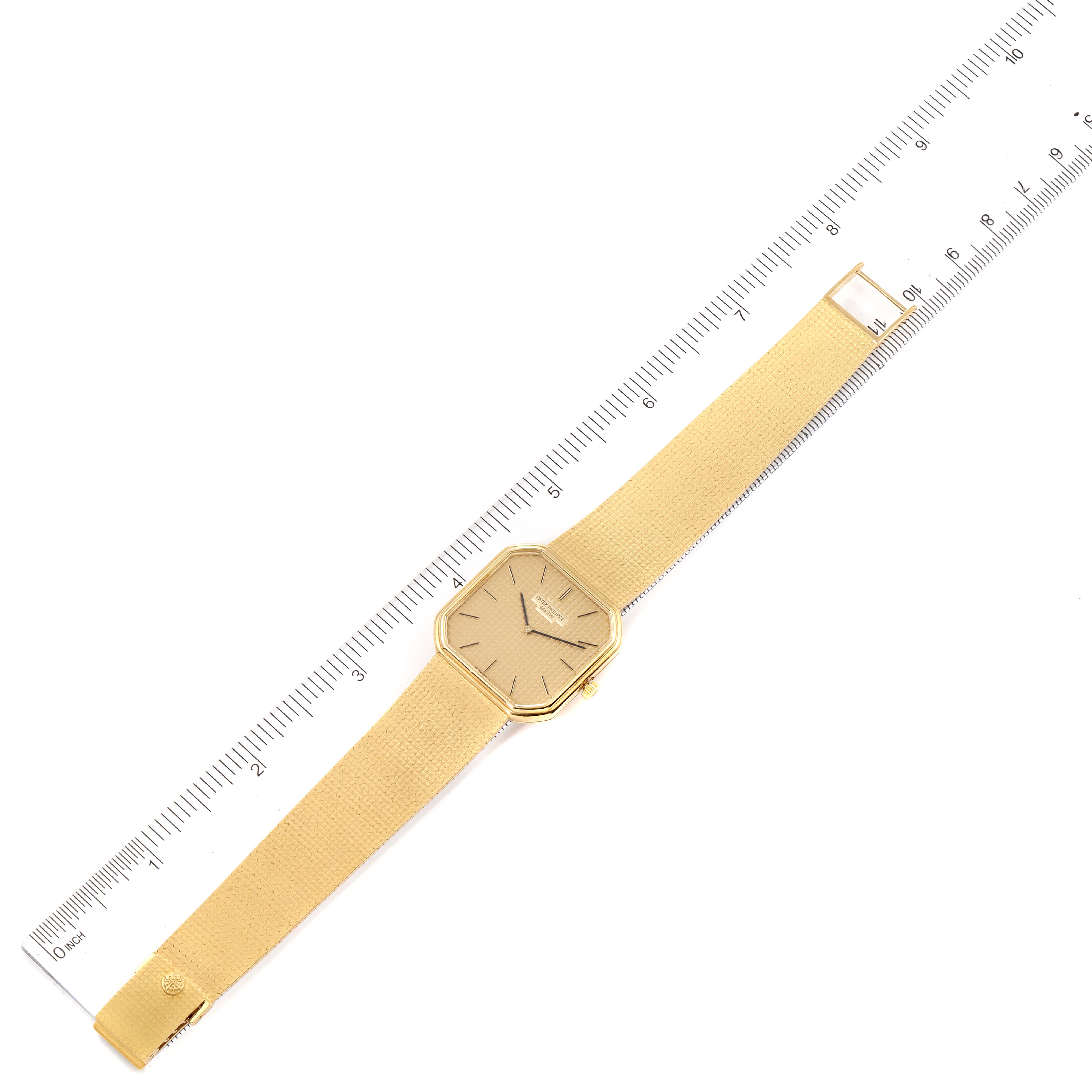The image shows a top-down view of a Patek Philippe Vintage 3854/3 Men's Yellow Gold Champagne Dial 3854/3 Men's Yellow Gold Champagne Dial model watch alongside a ruler for size reference.