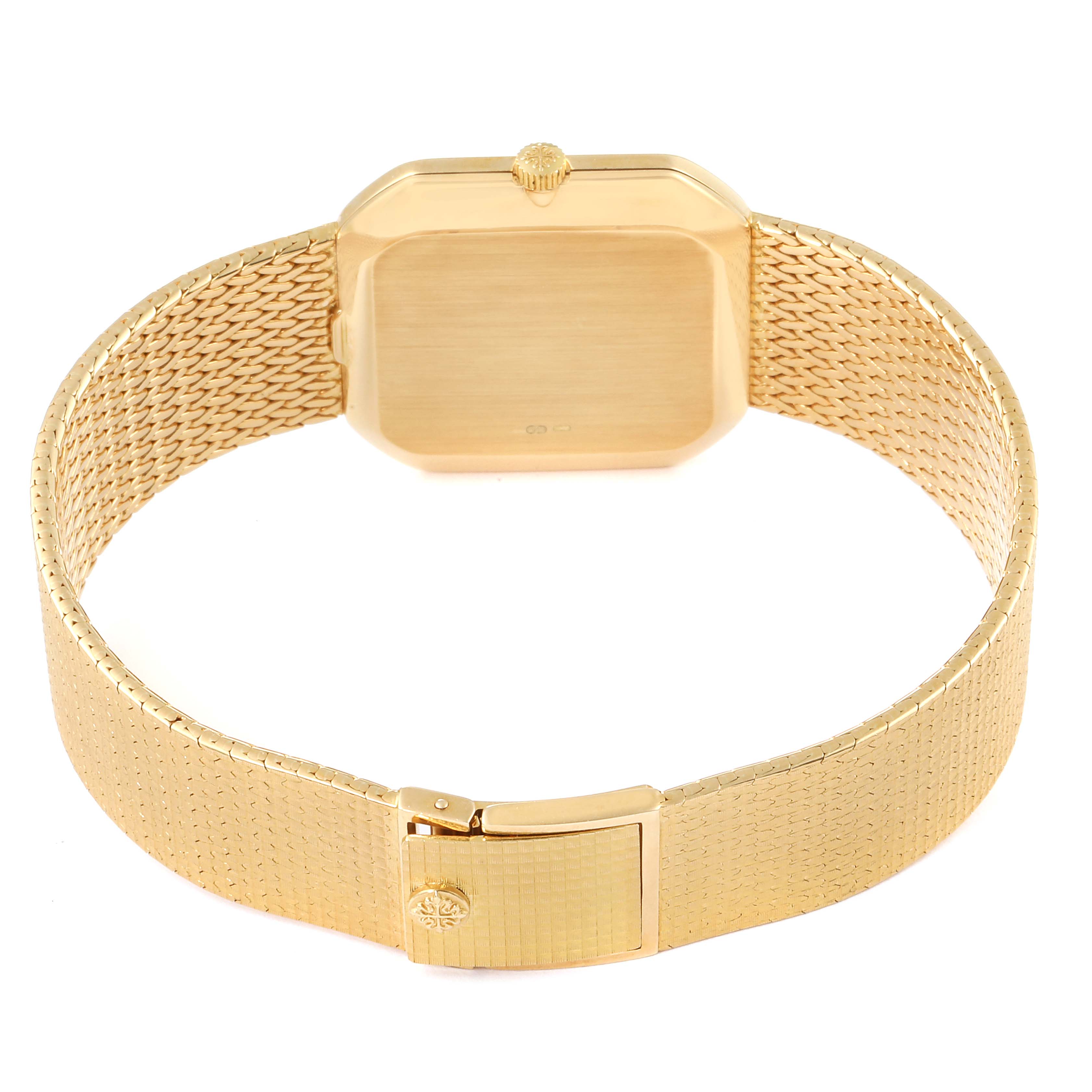 This image shows the back and strap of a Vintage Patek Philippe watch, highlighting its gold finish and clasp.