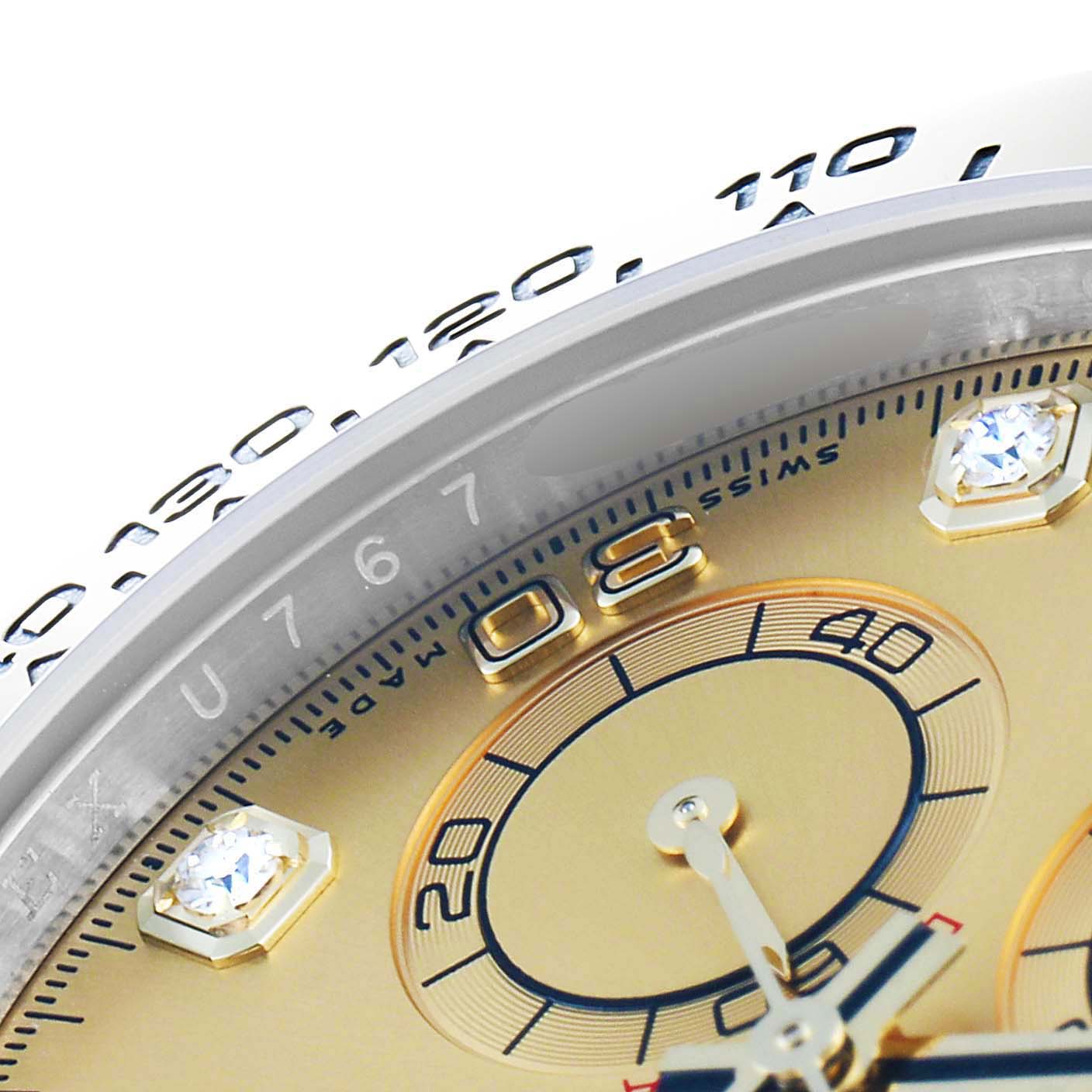 This close-up of the Rolex Daytona 116503 Men's Steel and Gold (two tone) Champagne Dial 116503 Men's Steel and Gold (two tone) Champagne Dial watch shows the dial, subdial, indices, and part of the tachymeter bezel.