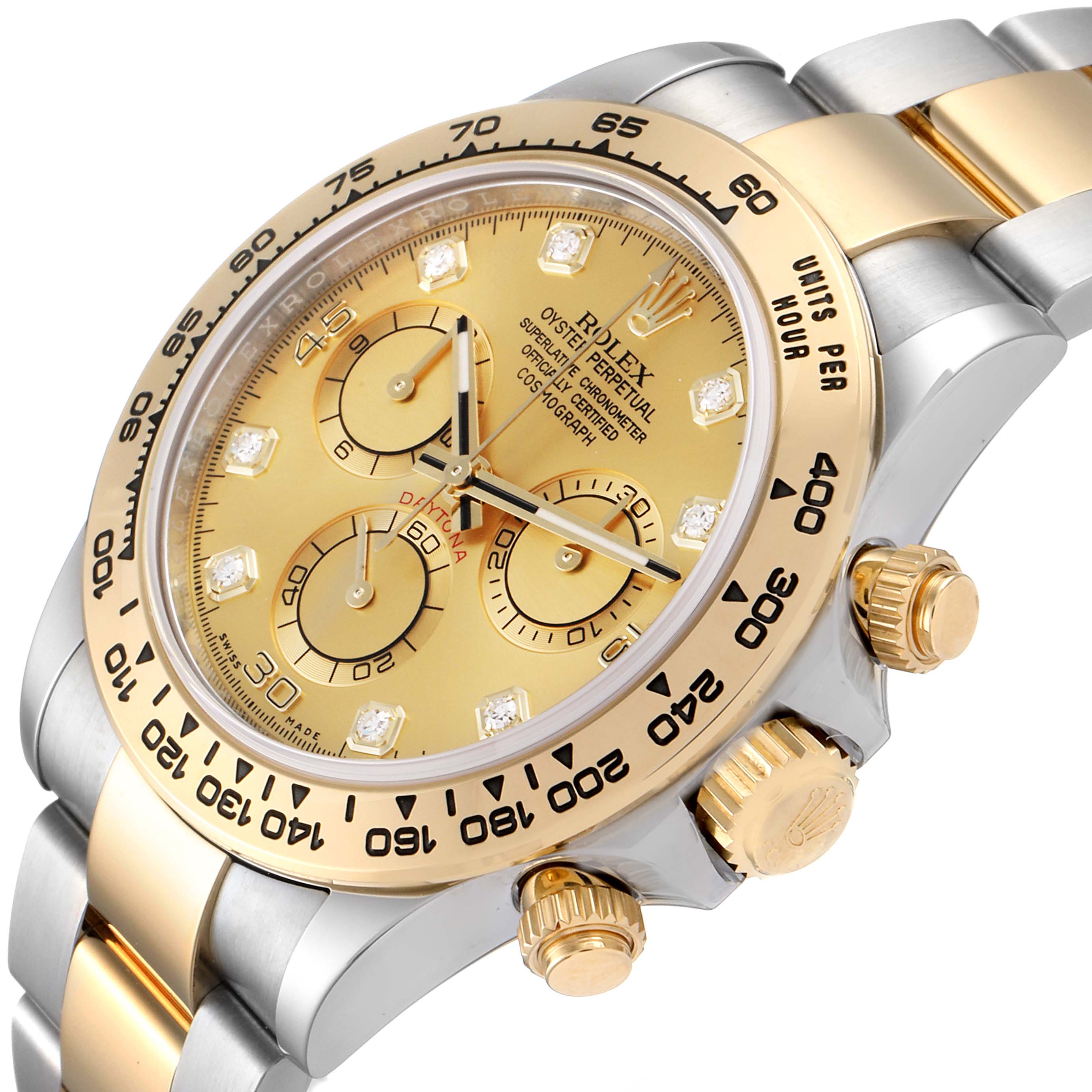 This image shows a close-up angle of the dial, bezel, and crown of a Rolex Daytona 116503 Men's Steel and Gold (two tone) Champagne Dial 116503 Men's Steel and Gold (two tone) Champagne Dial watch.
