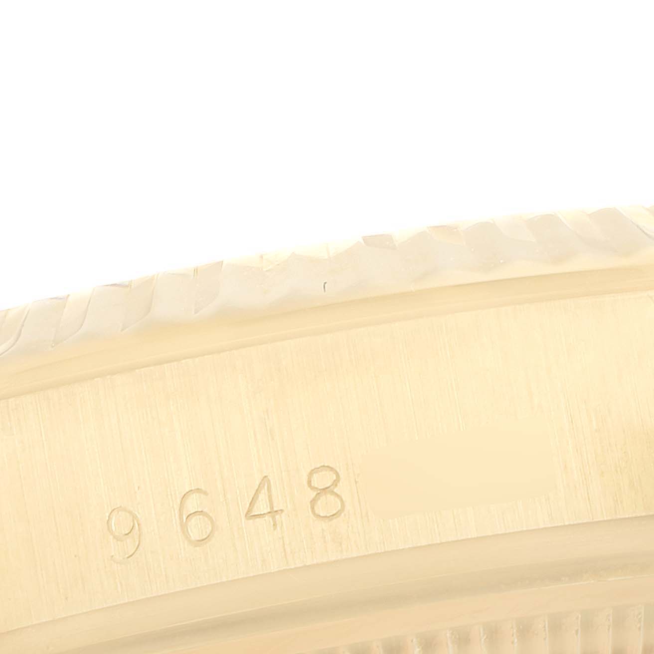 The image shows a close-up of the case side and bezel of a Rolex Date 15037 Men's Yellow Gold Black Dial 15037 Men's Yellow Gold Black Dial model watch, with some engraved numbers visible.