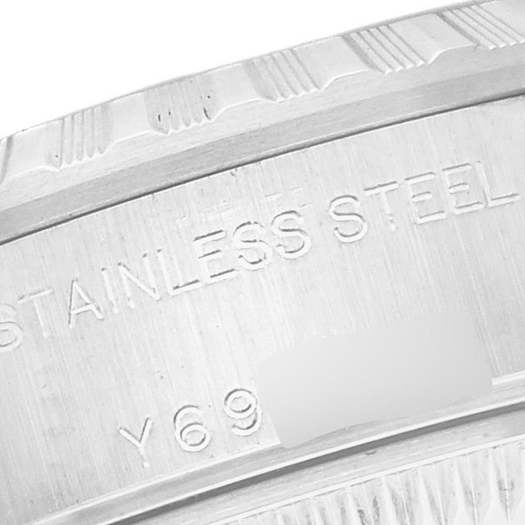 This image shows a close-up of the stainless steel case back of a Rolex Date 79240 Women's Stainless Steel Pink Dial 79240 Women's Stainless Steel Pink Dial model watch.