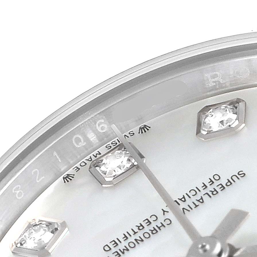 This close-up image of the Rolex Datejust 279174 Women's Stainless Steel Mother of Pearl Dial 279174 Women's Stainless Steel Mother of Pearl Dial watch shows part of the dial, including diamond hour markers and the hands.