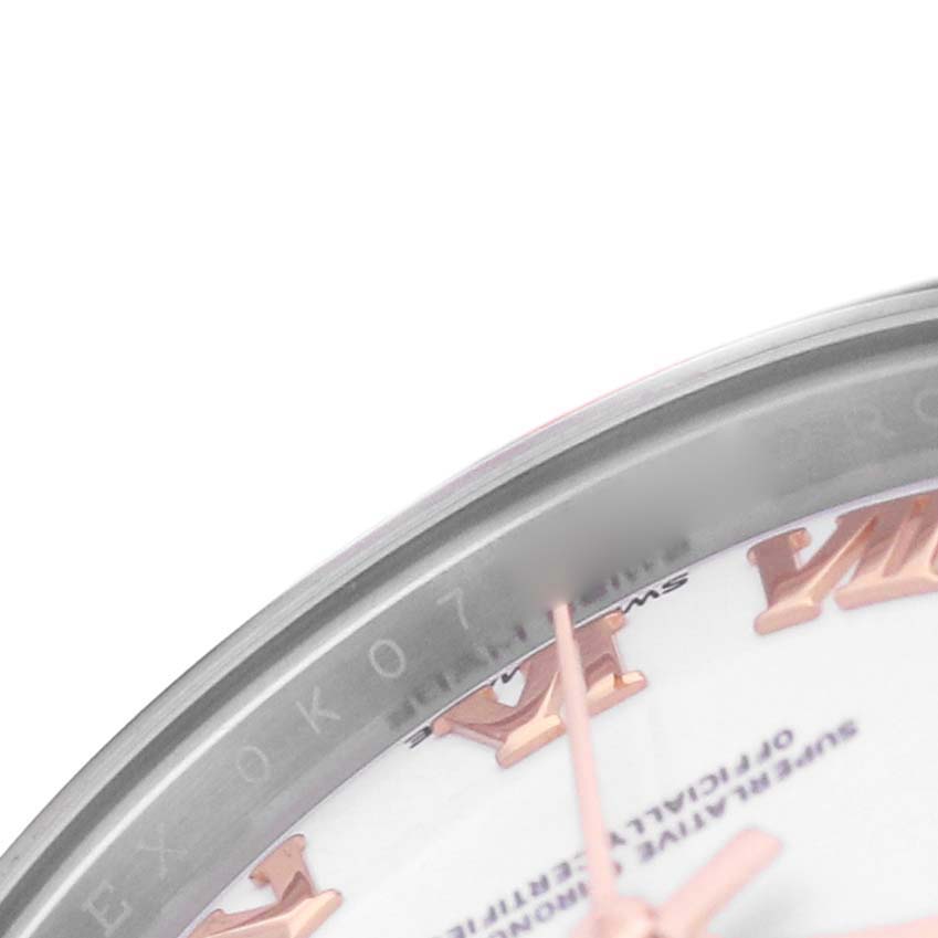 The image shows a close-up of the Rolex Datejust 279381 Women's Stainless Steel White Dial watch face, highlighting the Roman numerals and part of the bezel.