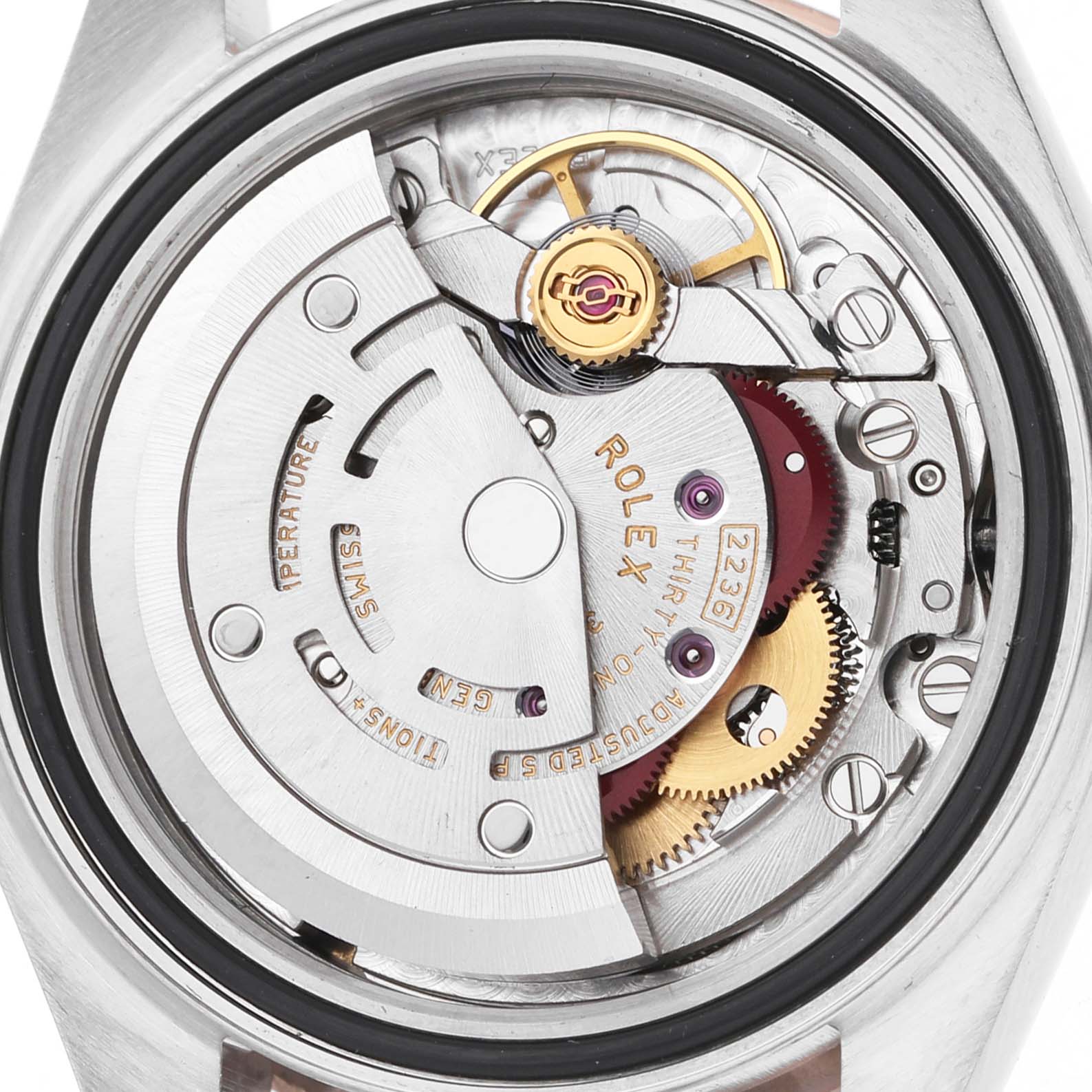 The image shows the open case back of a Rolex Datejust 279381 Women's Stainless Steel White Dial watch, revealing its intricate movement and components.