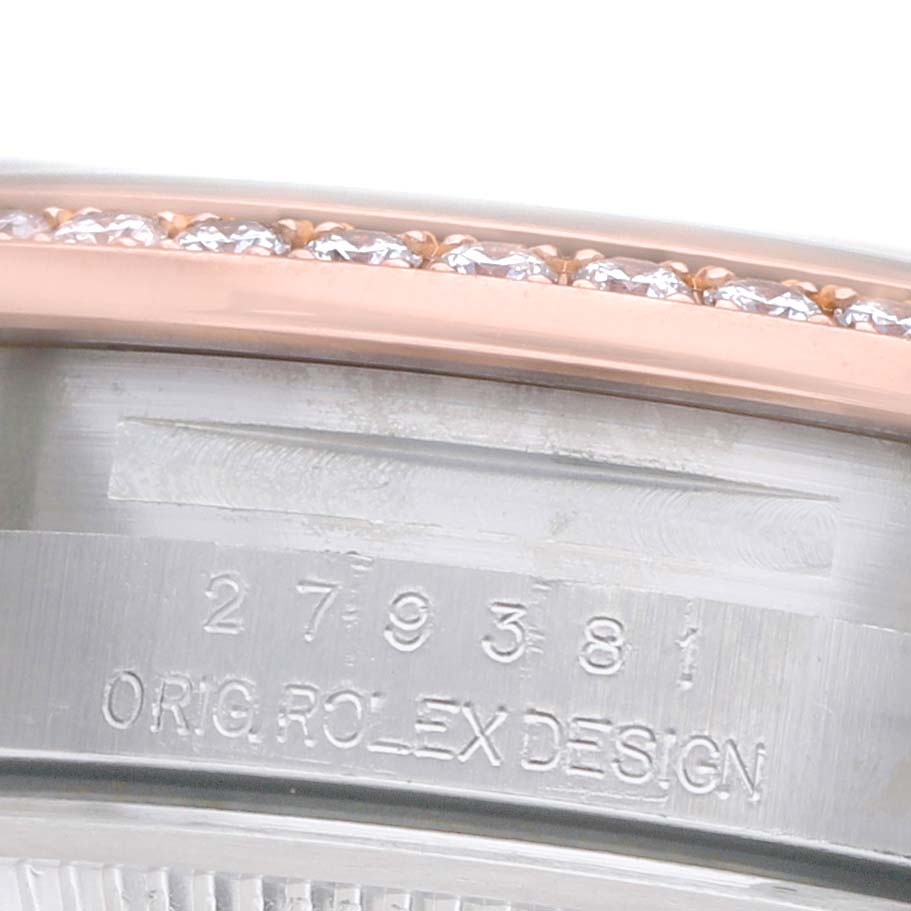 The image shows a close-up of the Rolex Datejust 279381 Women's Stainless Steel White Dial's bezel with diamonds and engraved watch case details.